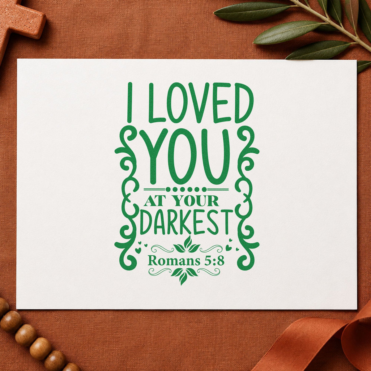 Loved at Your Darkest Scrolls craft stamp imprint in green ink on a handmade project, one idea being jail ministry notes.