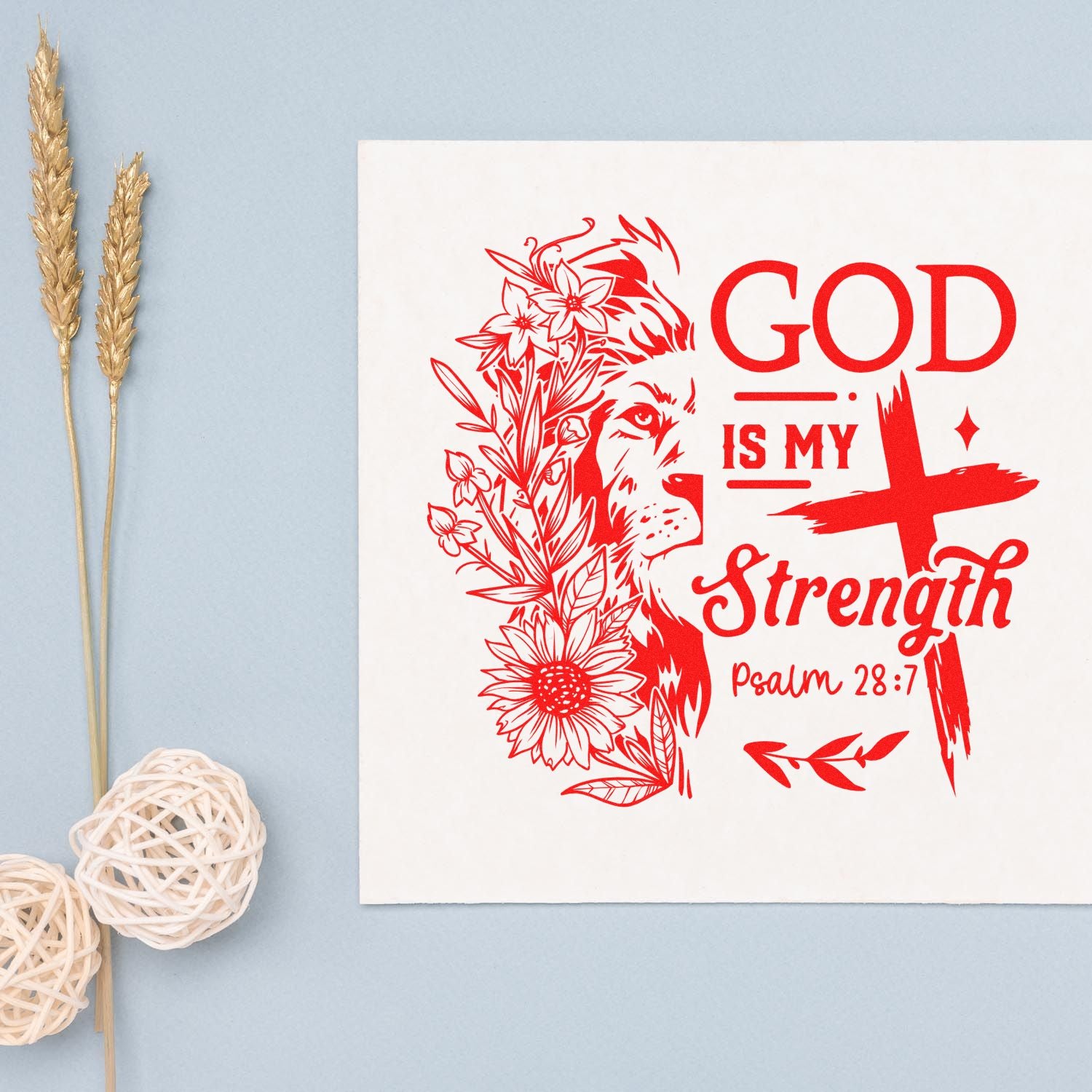Christian rubber stamp design with lion and flowers, reading God Is My Strength, Psalm 28:7 in bold red.