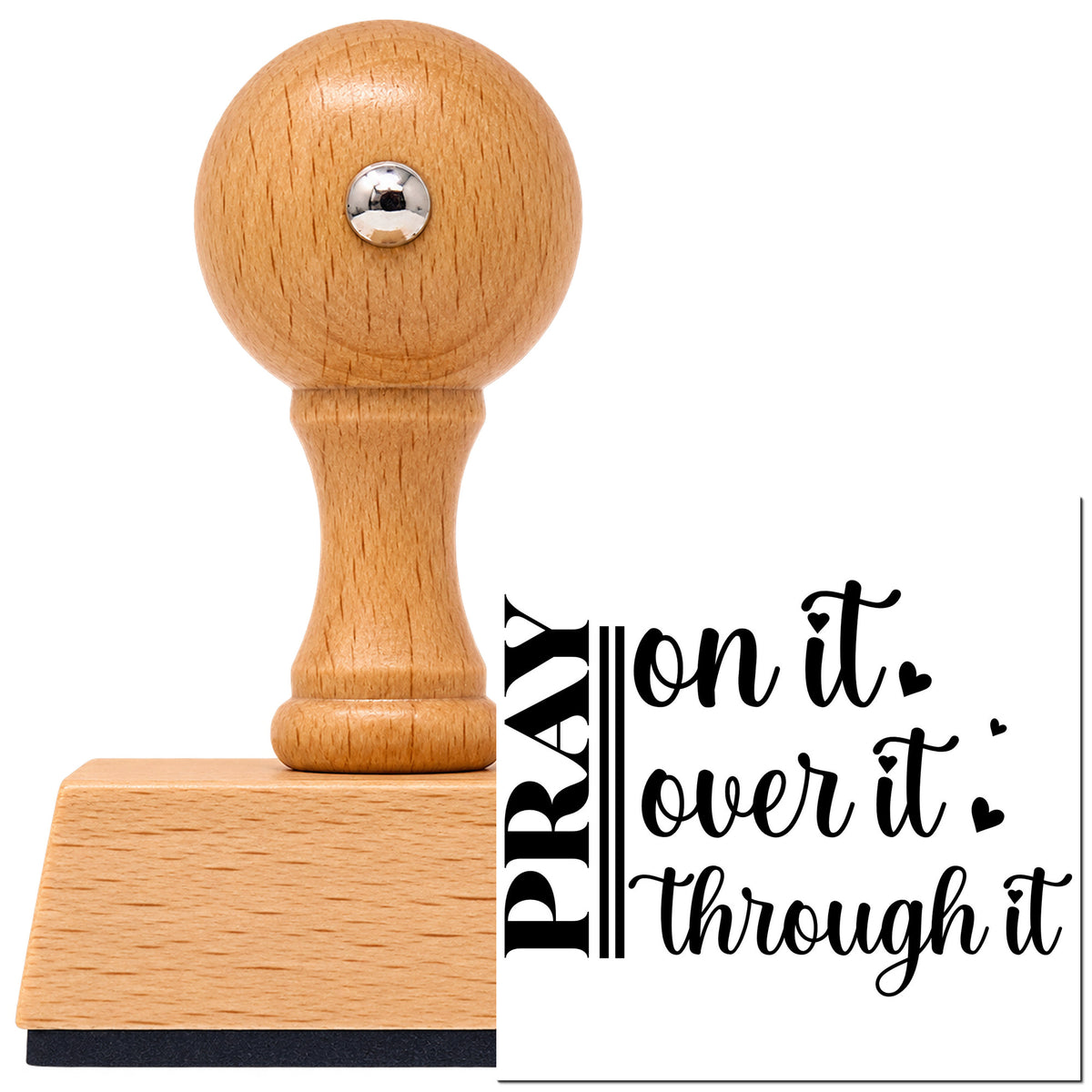 Pray On It Heart Script Lettering Vintage Pro rubber stamp in European beech wood with a round knob handle, shown beside its black imprint.