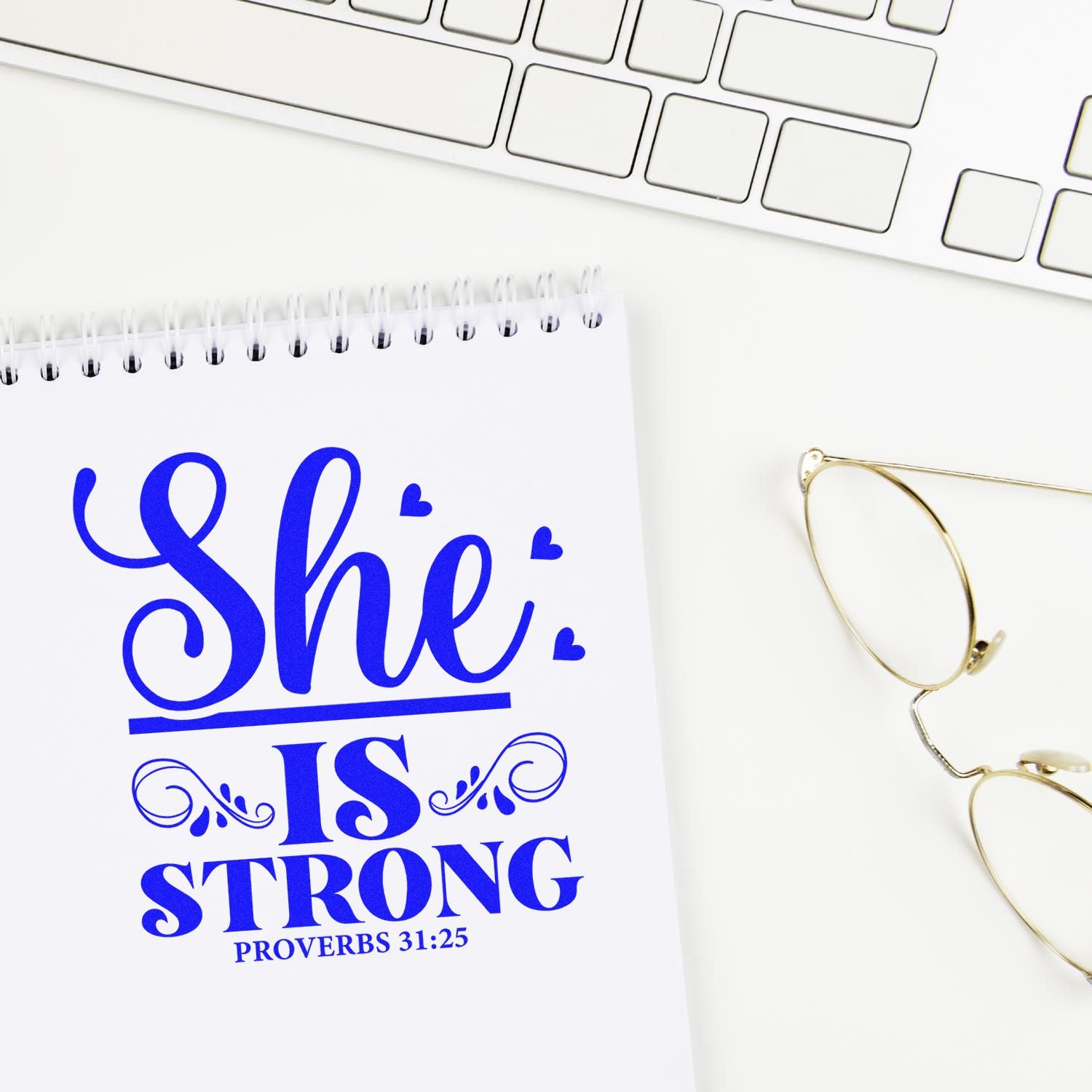 Christian rubber stamp design reading She is Strong Proverbs 31:25 for Bible journaling, faith gifts, and womens encouragement.