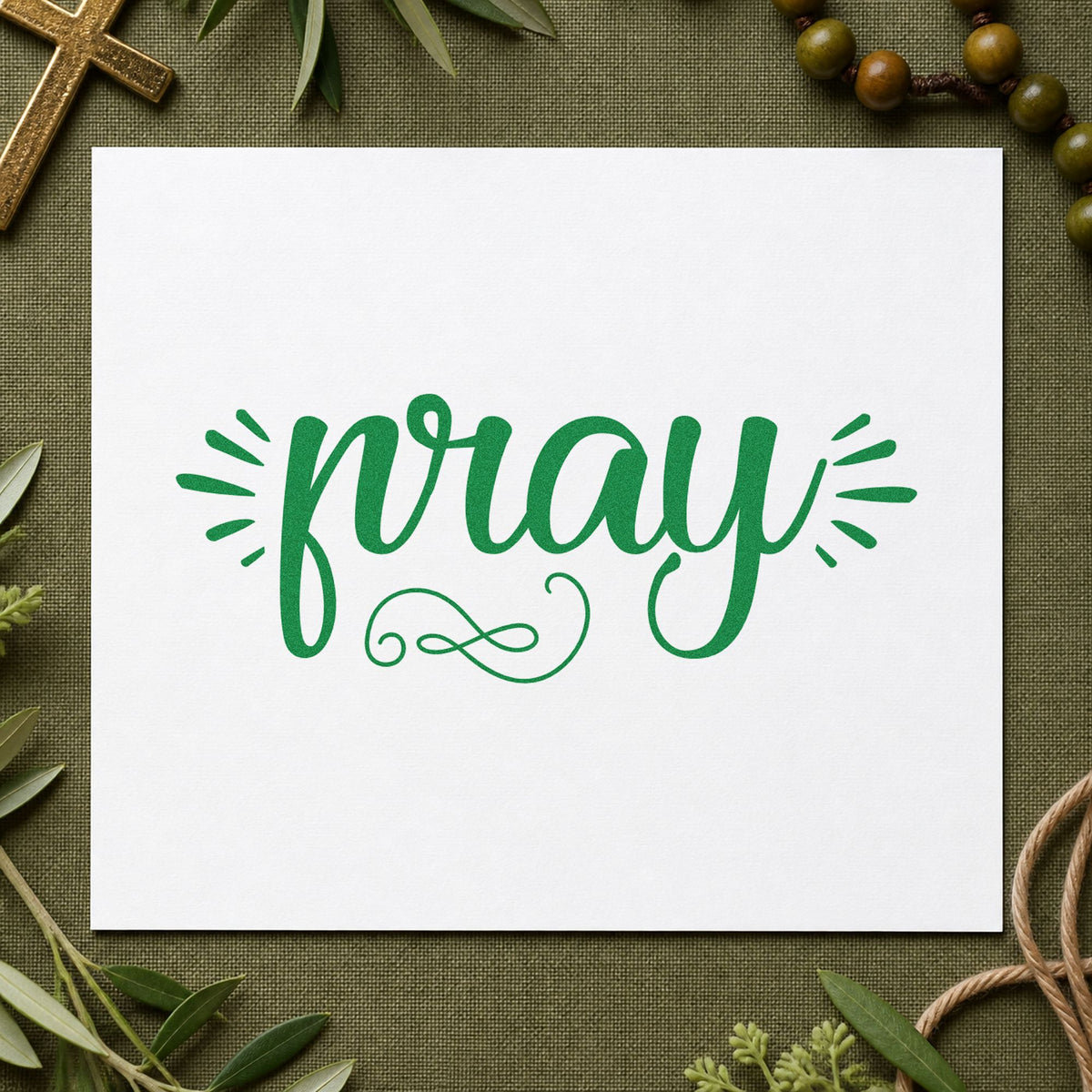 Pray Radiating Script craft stamp imprint in green ink on a handmade project, one idea being framed shelf art.