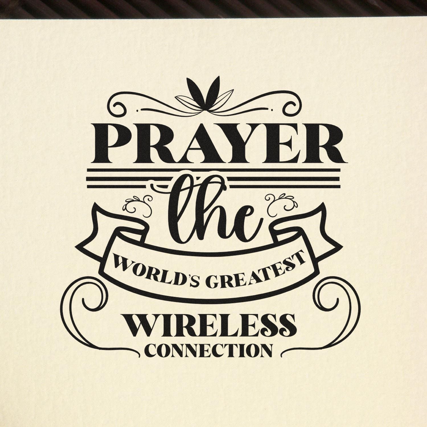 Decorative rubber stamp design with the quote Prayer: the worlds greatest wireless connection in bold vintage lettering.