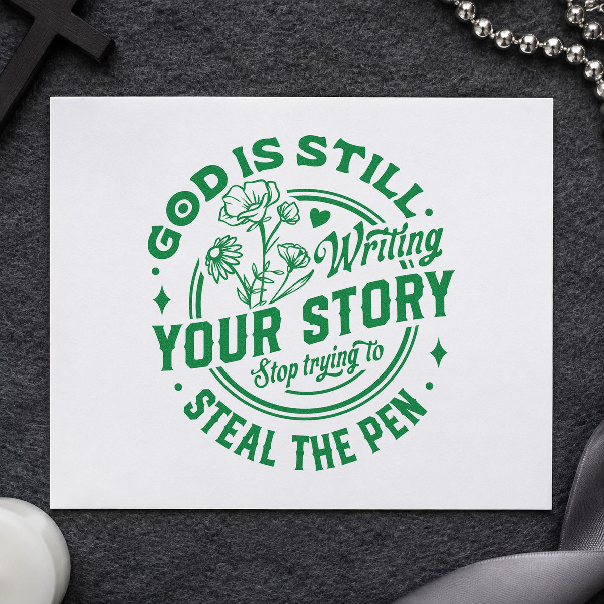 God Is Writing Your Story Flowers craft stamp imprint in green ink on a handmade project, one idea being framed reading nook art.