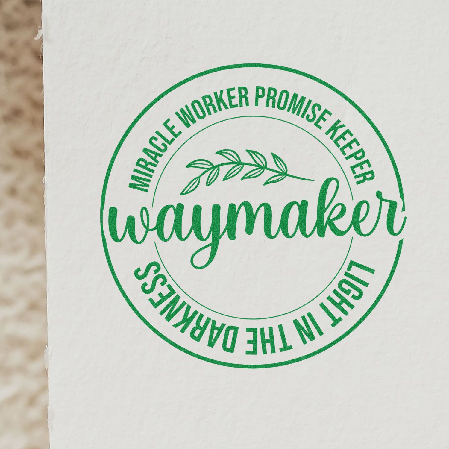 Green Christian rubber stamp design reading Miracle Worker, Promise Keeper, Waymaker, Light in the Darkness.