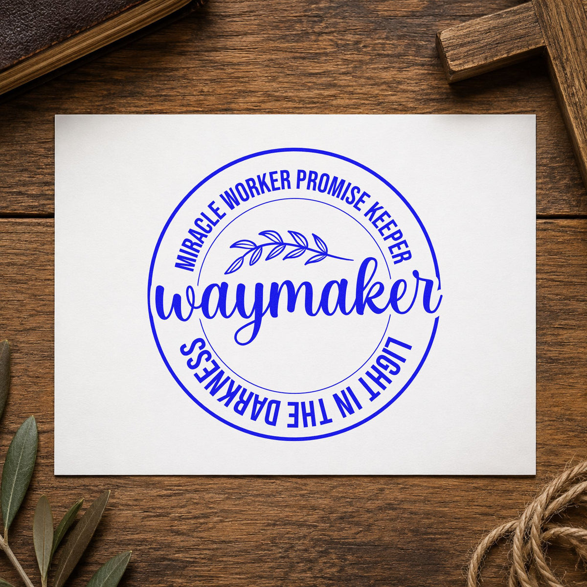 Waymaker Leaf Badge craft stamp in blue ink on cardstock, an easy option for coasters.