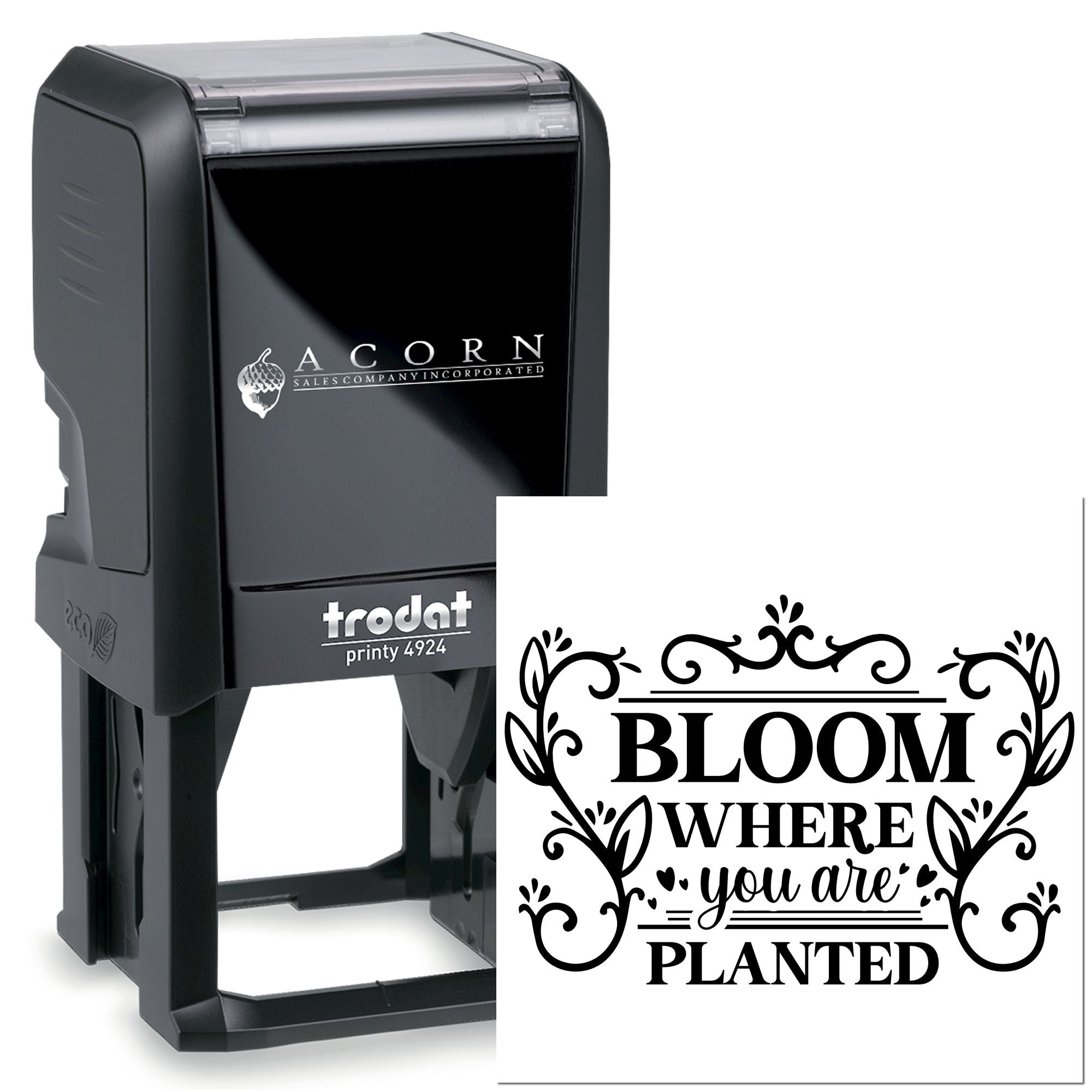 Self-inking rubber stamp with custom floral quote imprint reading Bloom where you are planted for crafts and business branding.