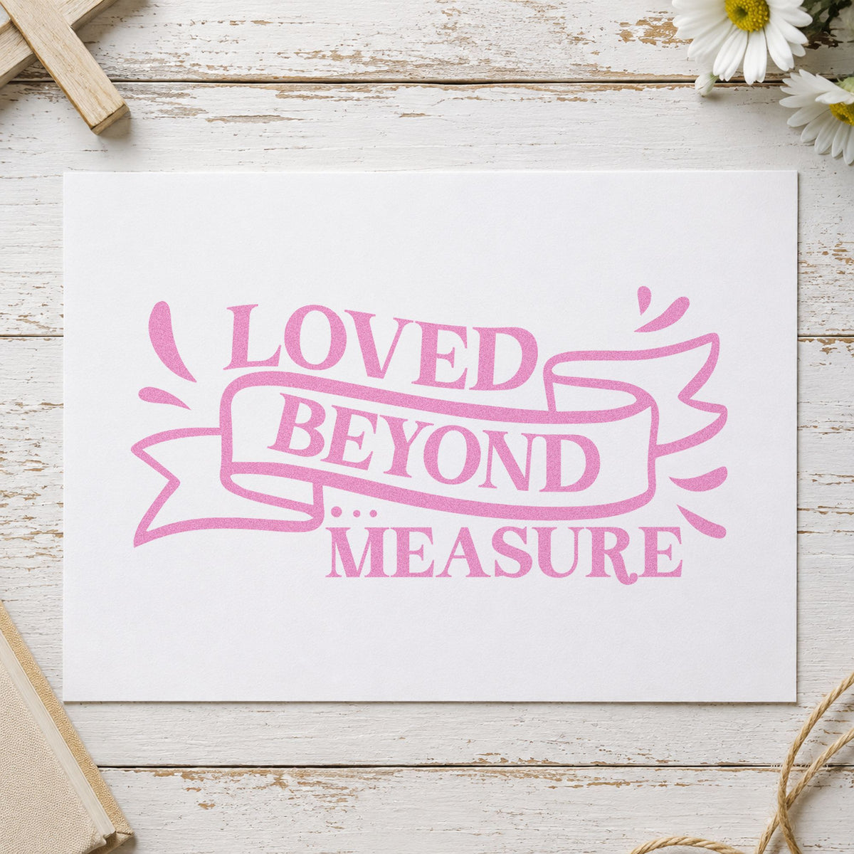 Loved Beyond Measure Ribbon craft stamp in purple ink on cardstock, an easy option for growth chart headers.