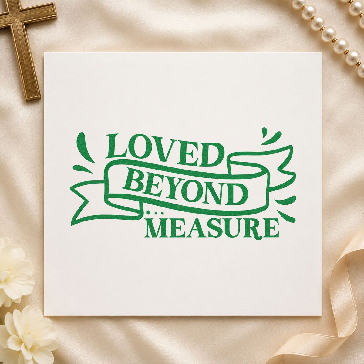Loved Beyond Measure Ribbon craft stamp imprint in green ink on a handmade project, one idea being framed nursery art.