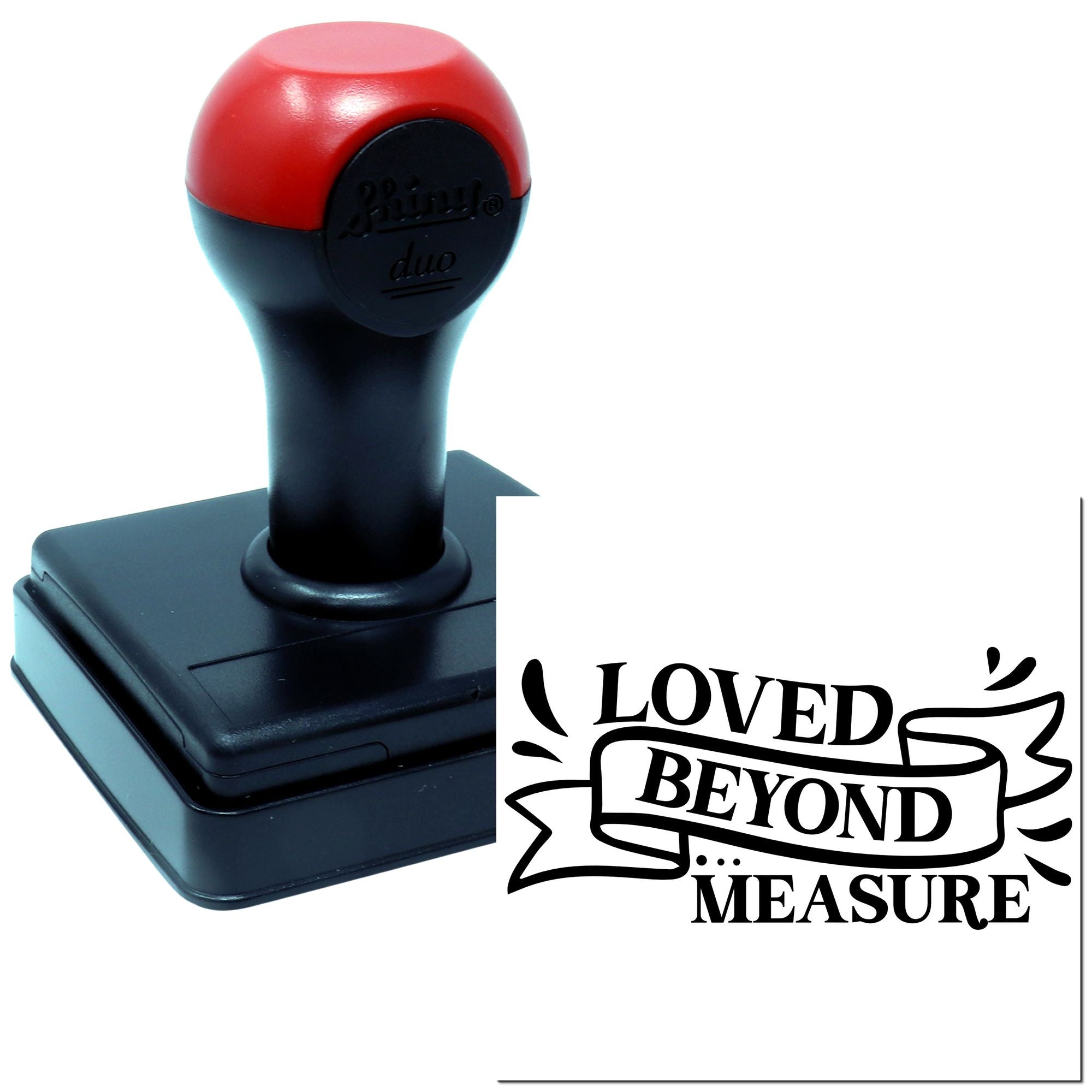 Self-inking rubber stamp with Loved Beyond Measure imprint, ideal for custom love-themed crafting and cards.