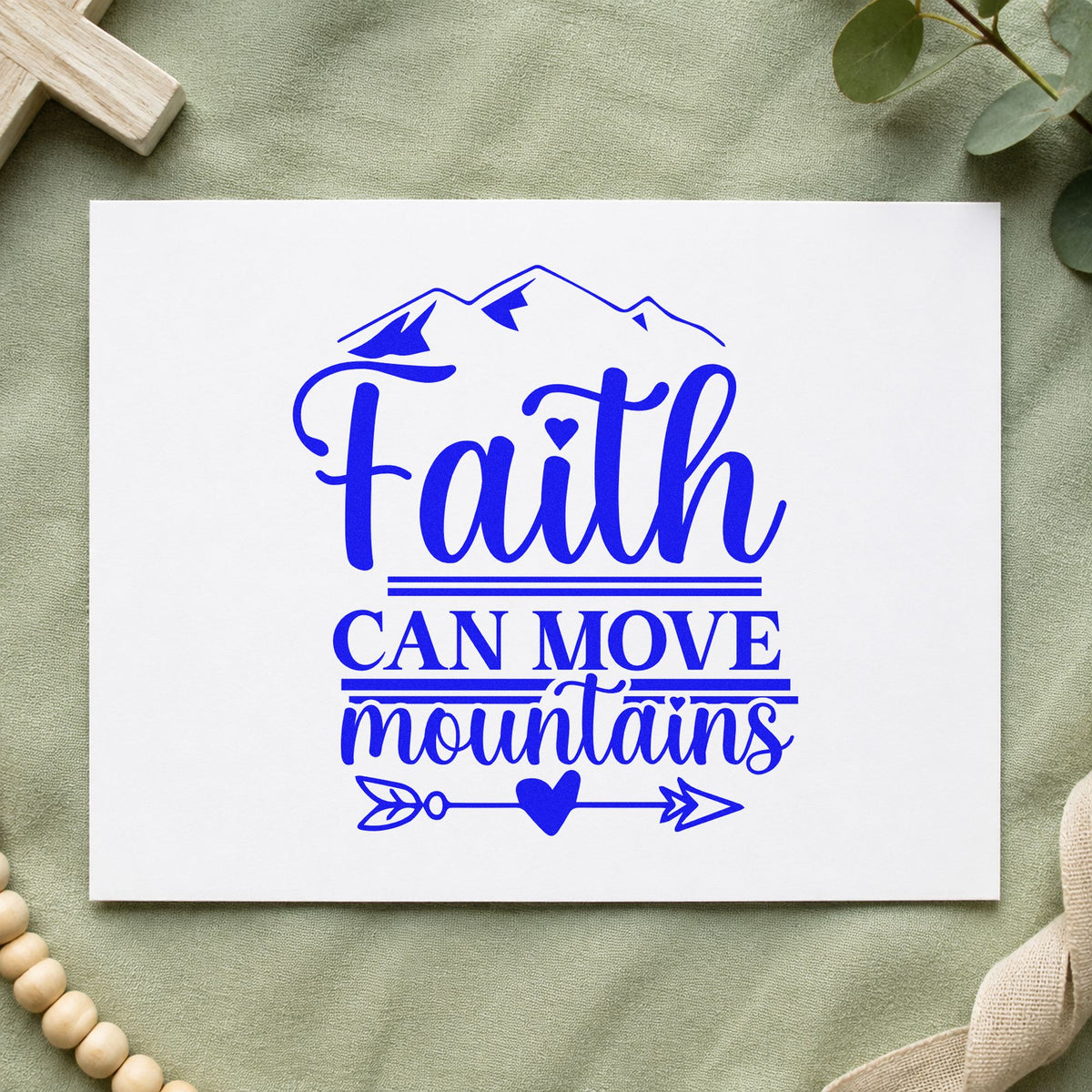 Faith Moves Mountains Heart Arrow craft stamp in blue ink on cardstock, an easy option for canvas totes.