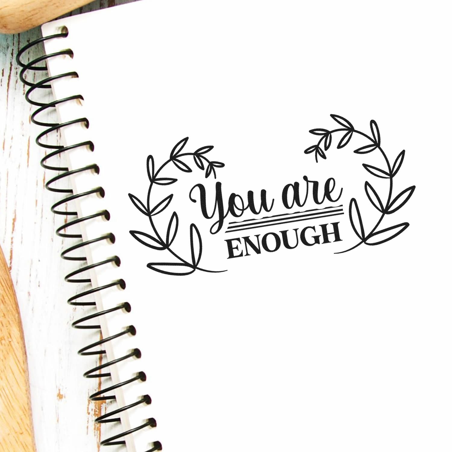 You Are Enough floral wreath rubber stamp design on spiral notebook, inspirational craft stamp for journaling