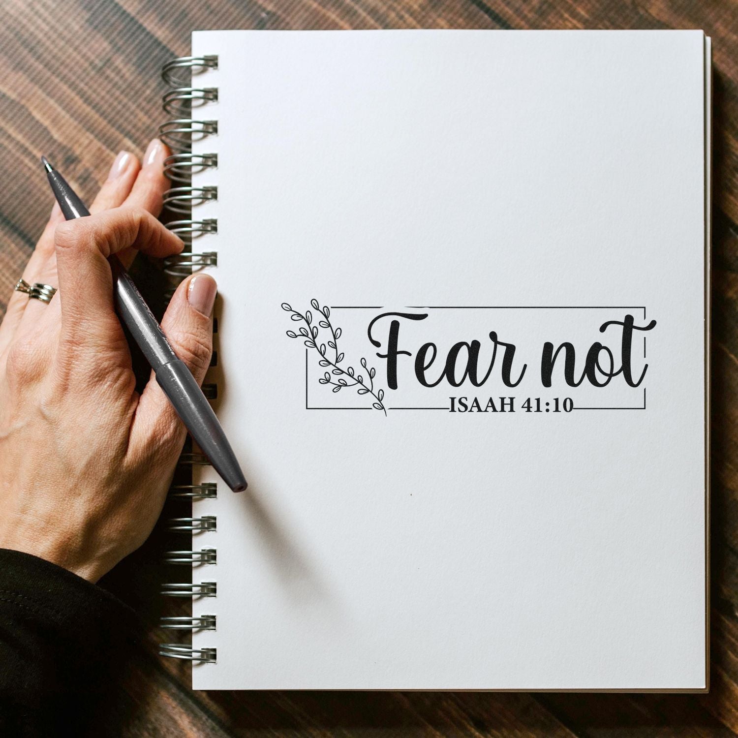 Bible verse rubber stamp saying Fear Not Isaiah 41:10 on a notebook page for journaling and faith-inspired crafts.