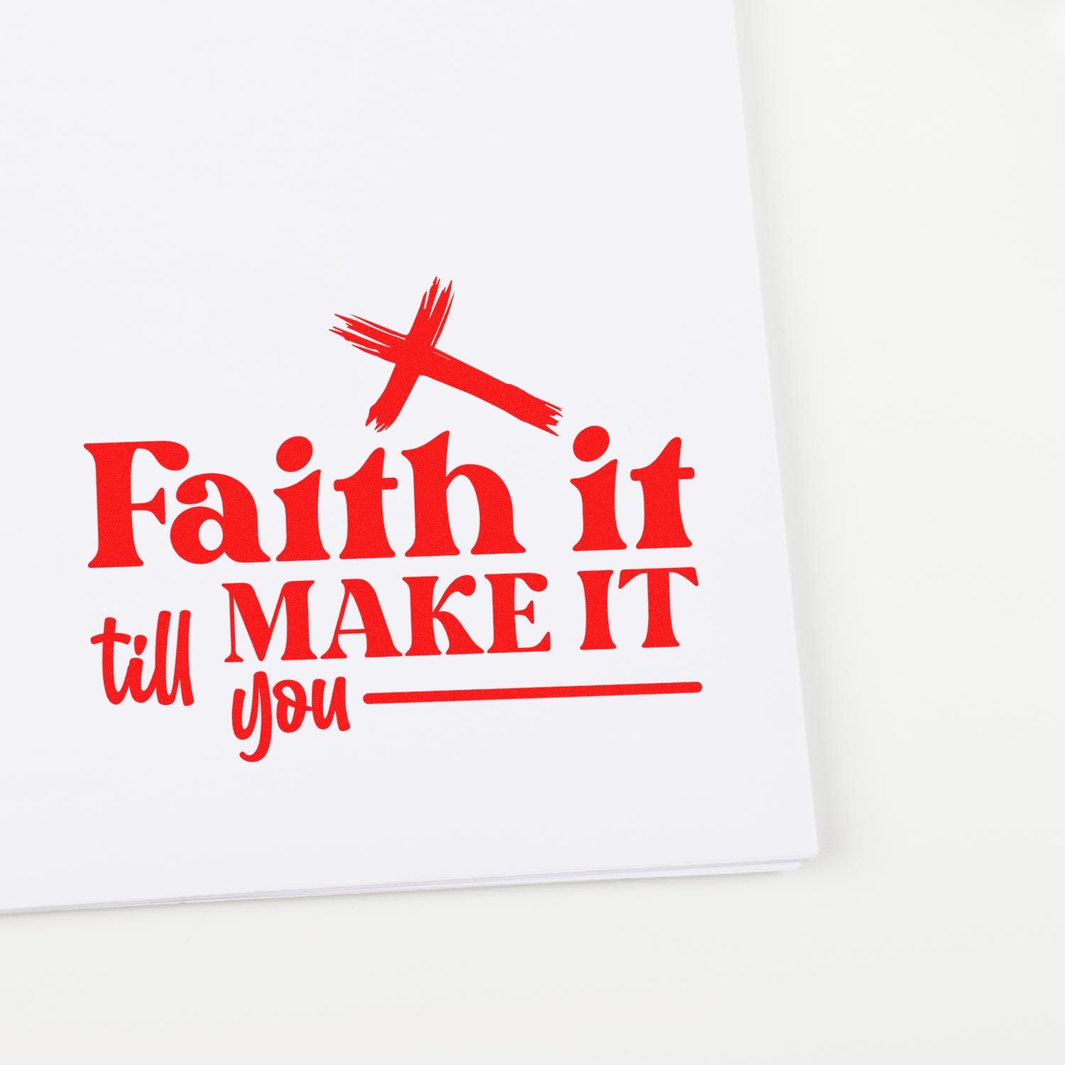 Red Christian quote rubber stamp reading Faith it till you make it with cross icon on a white background