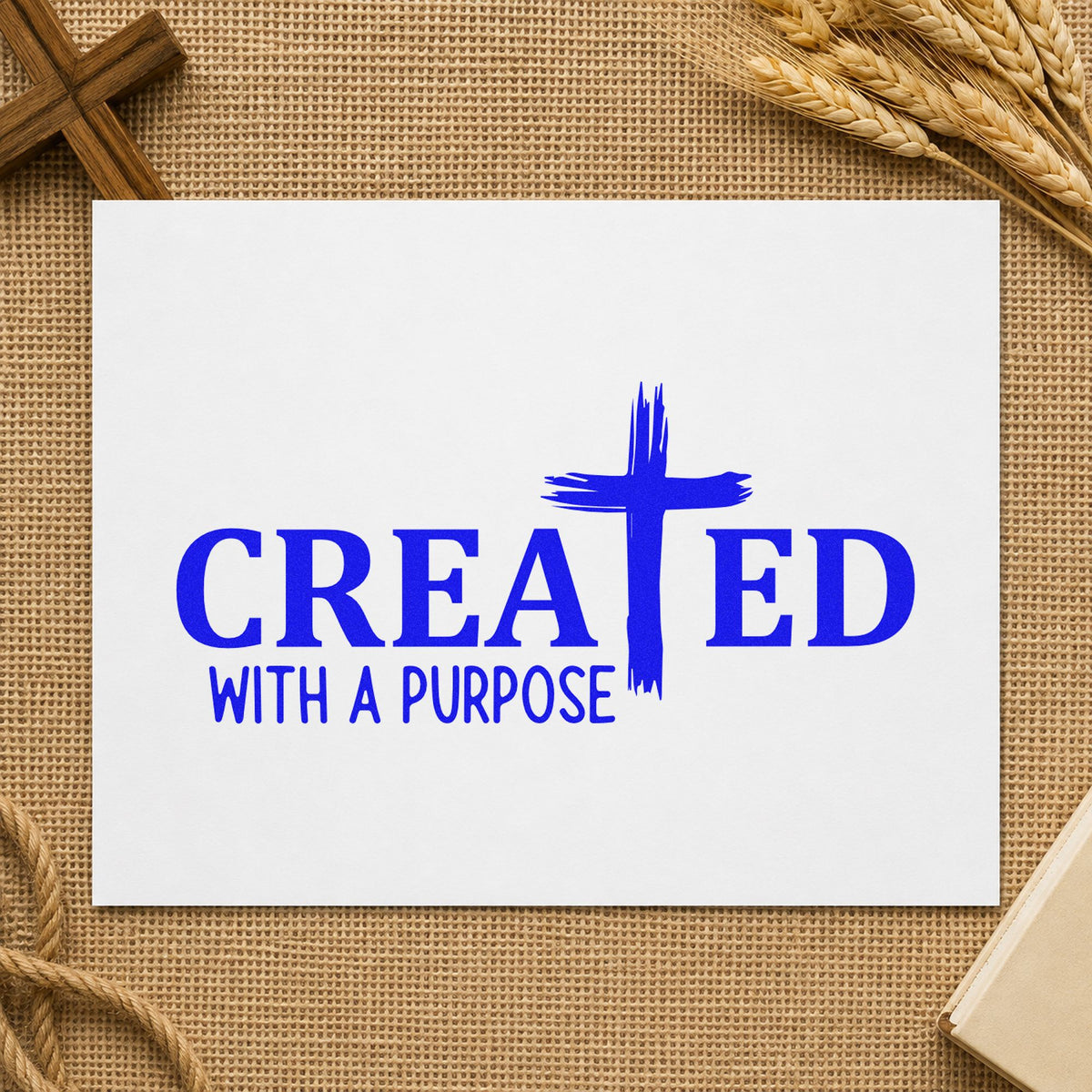 Created Brushstroke Cross craft stamp imprinted in blue ink on paper, a design suited to special needs welcomes.