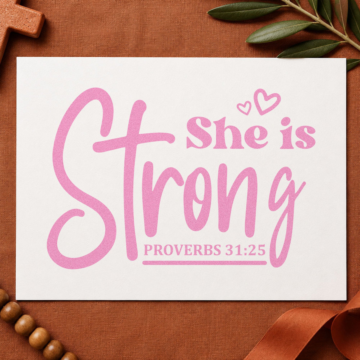She Is Strong Cross Script craft stamp in purple ink on cardstock, an easy option for mother's day gifts.