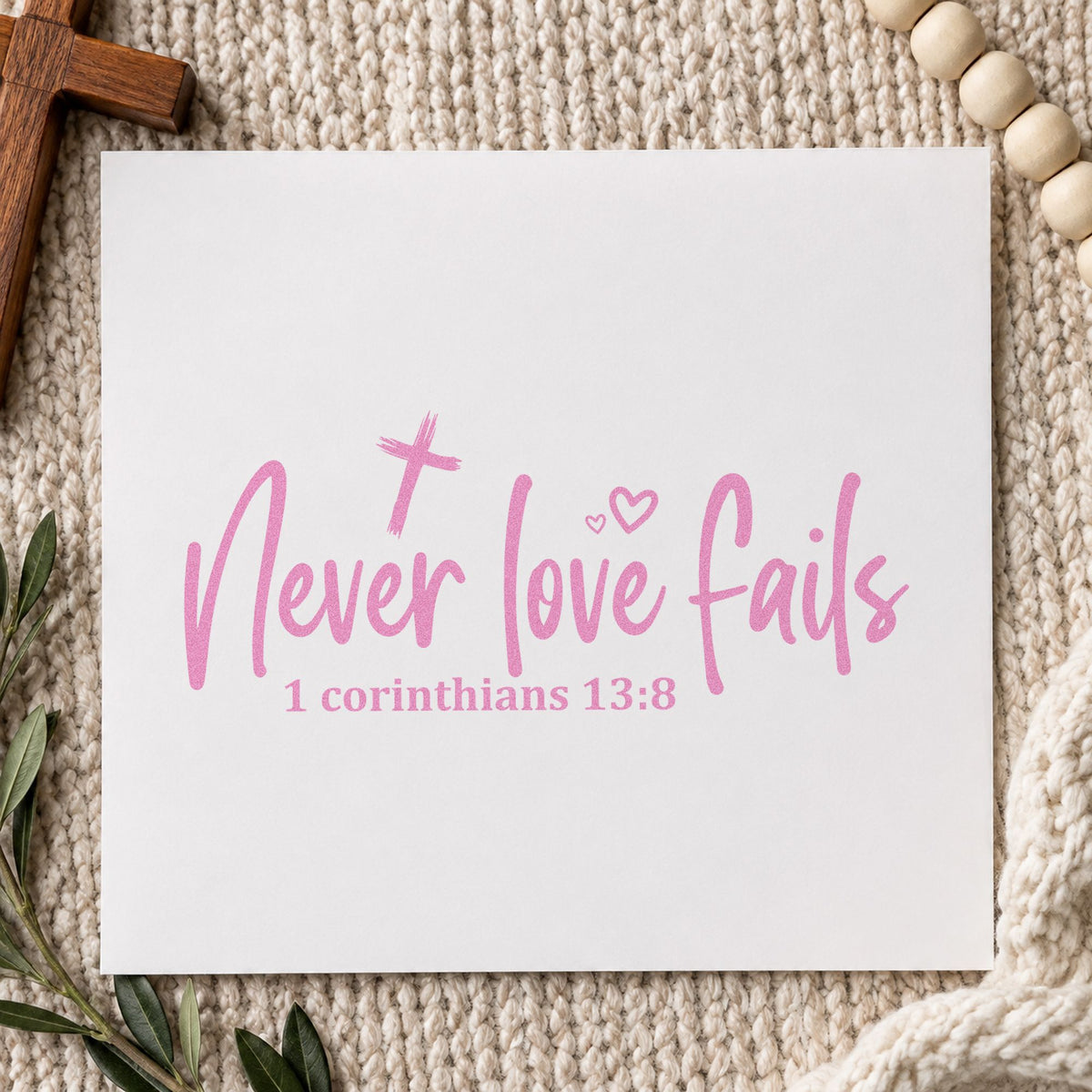 Never Love Fails craft stamp in purple ink on cardstock, an easy option for anniversary gifts.