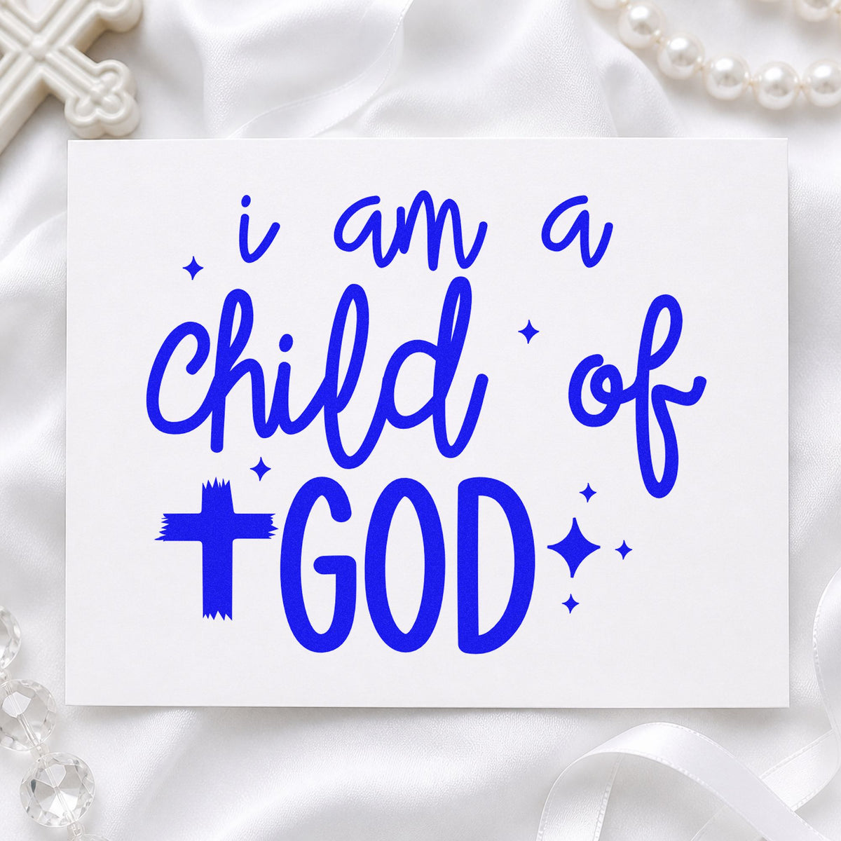 I Am a Child of God craft stamp in blue ink on cardstock, an easy option for onesie stamping.