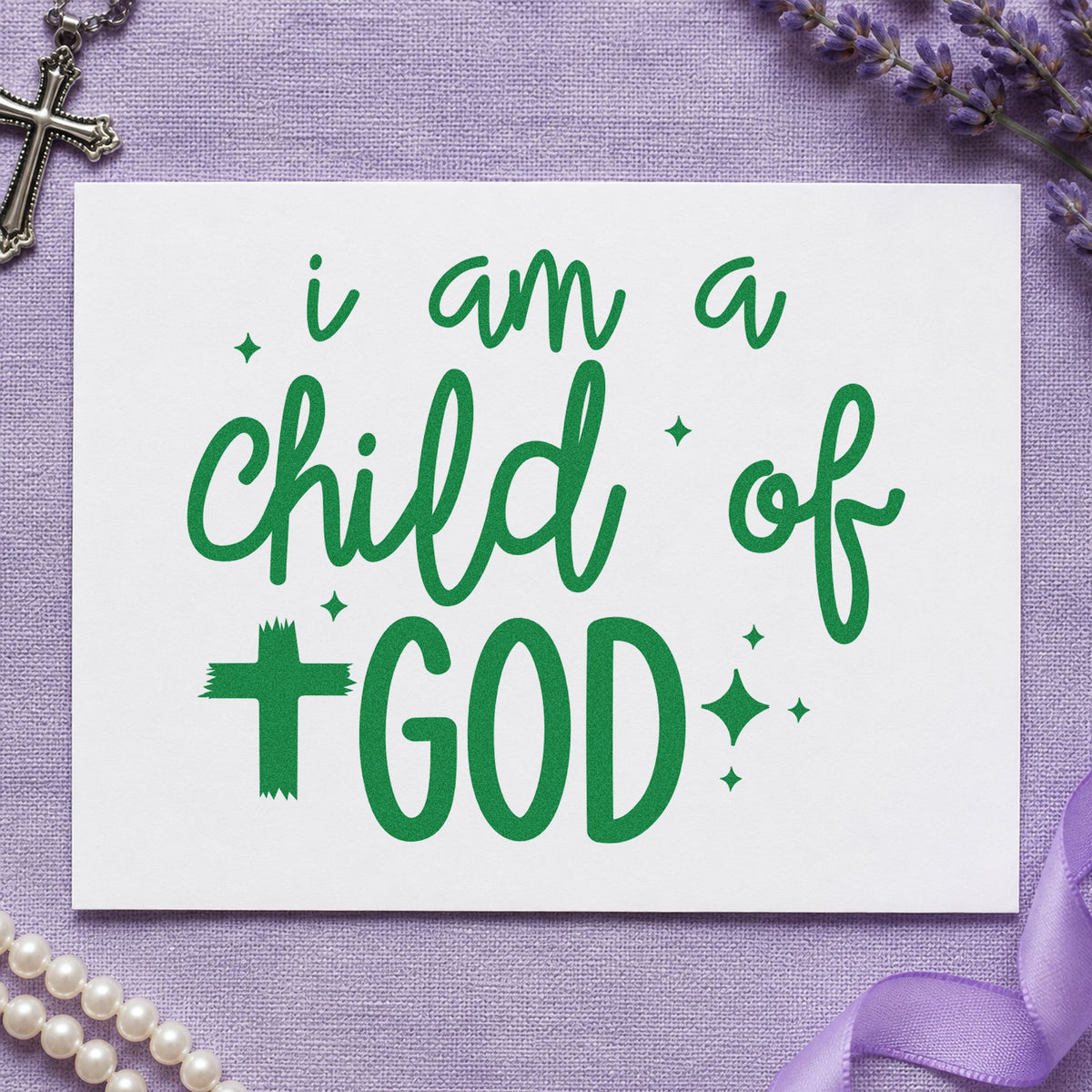 I Am a Child of God craft stamp imprint in green ink on a handmade project, one idea being framed nursery art.