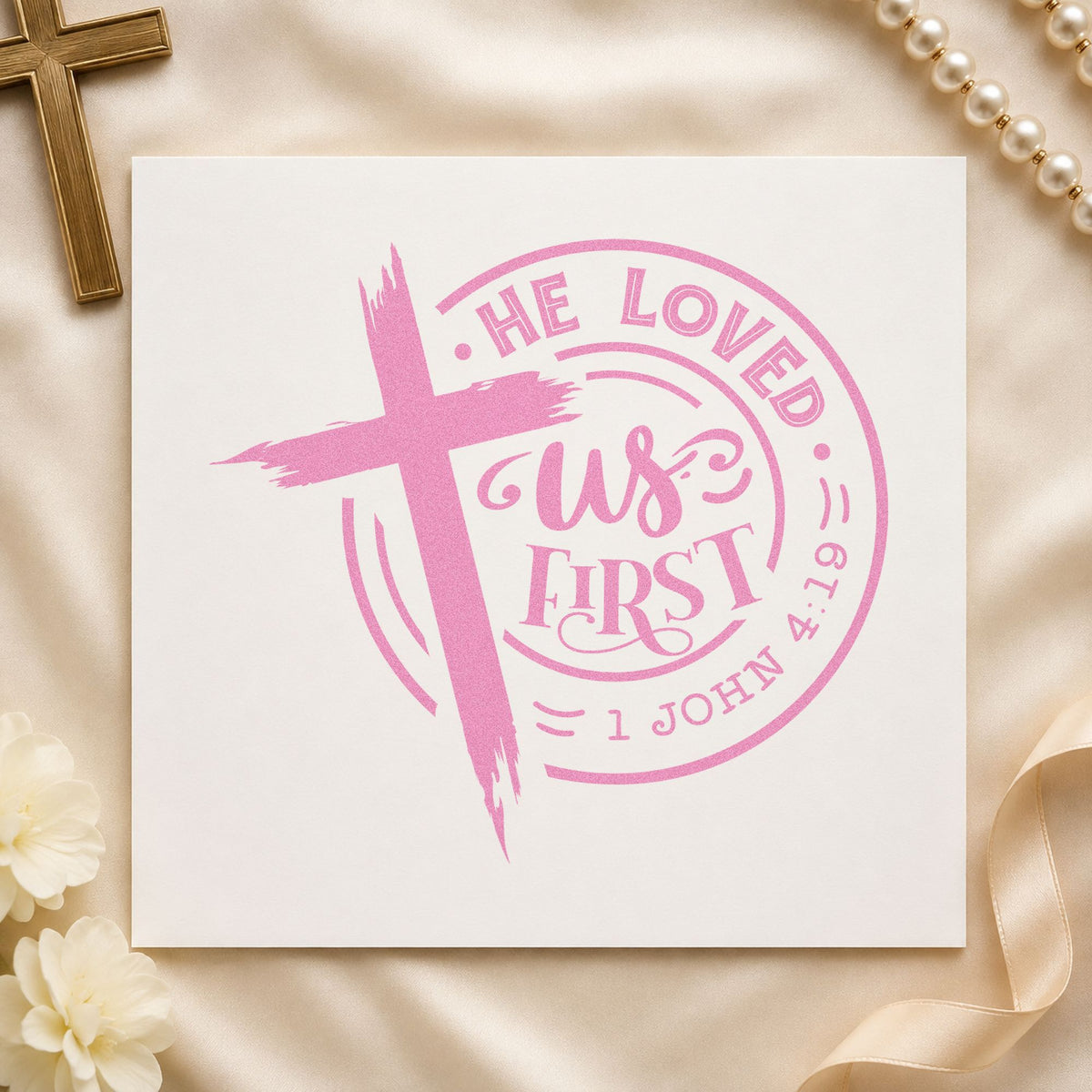 He Loved Us First Badge craft stamp in purple ink on cardstock, an easy option for baptism gift tags.