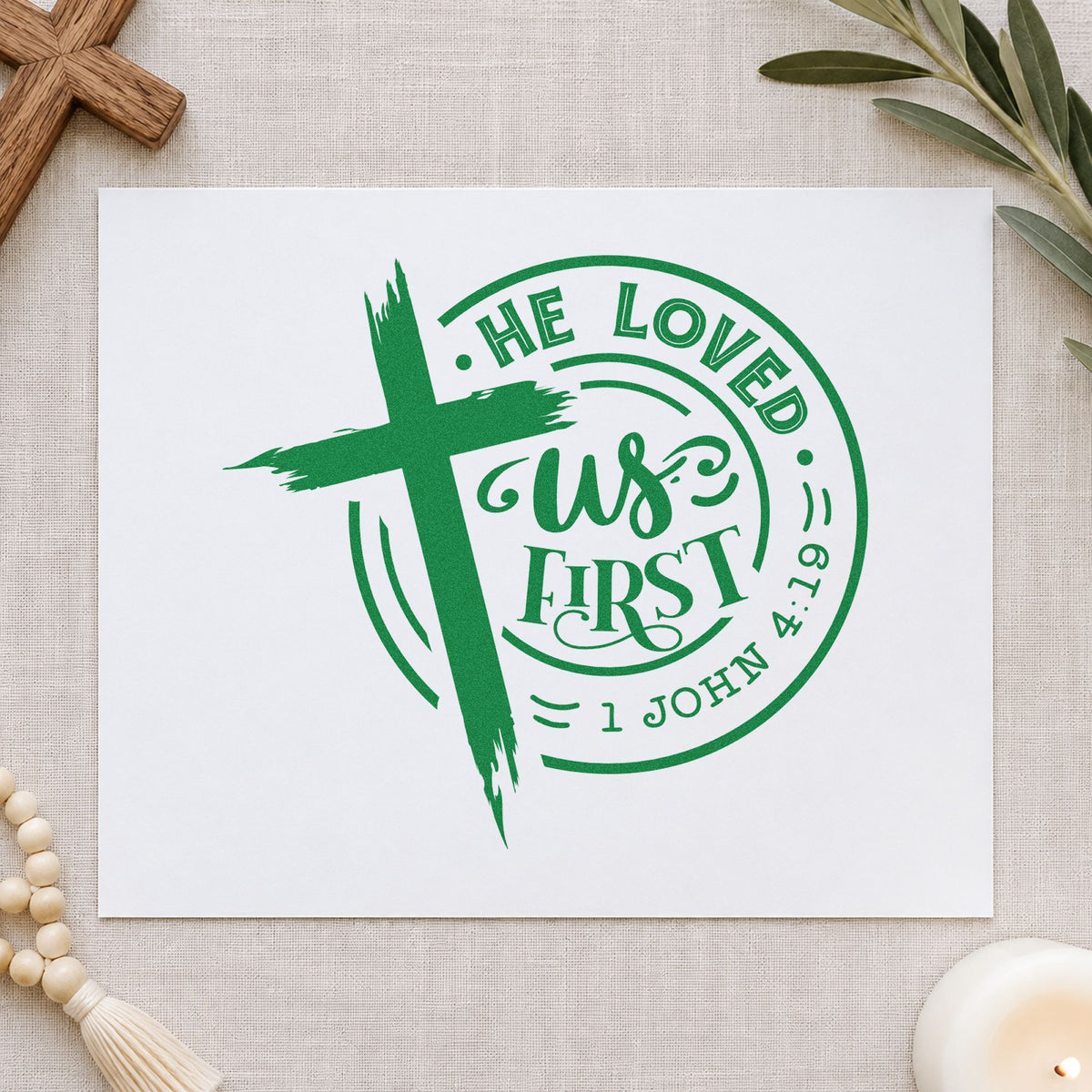 He Loved Us First Badge craft stamp imprint in green ink on a handmade project, one idea being round sticker seals.