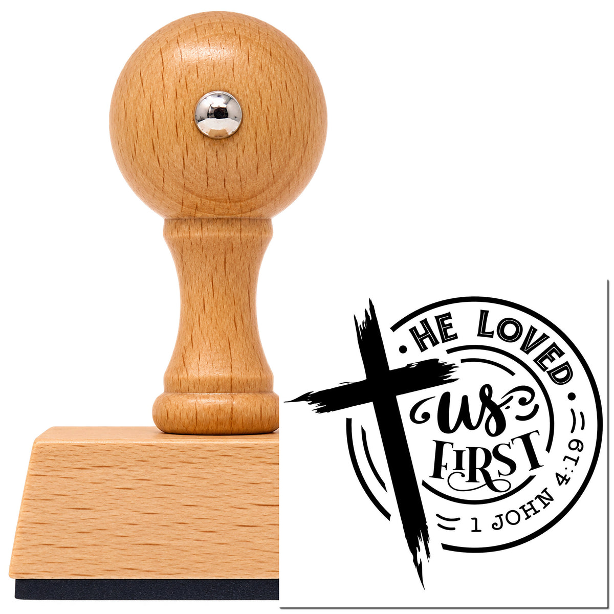 He Loved Us First Badge Vintage Pro rubber stamp in European beech wood with a round knob handle, shown beside its black imprint.