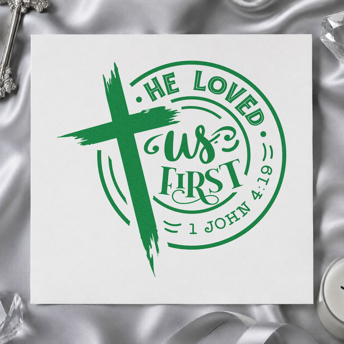 He Loved Us First Round craft stamp imprint in green ink on a handmade project, one idea being quilt label patches.
