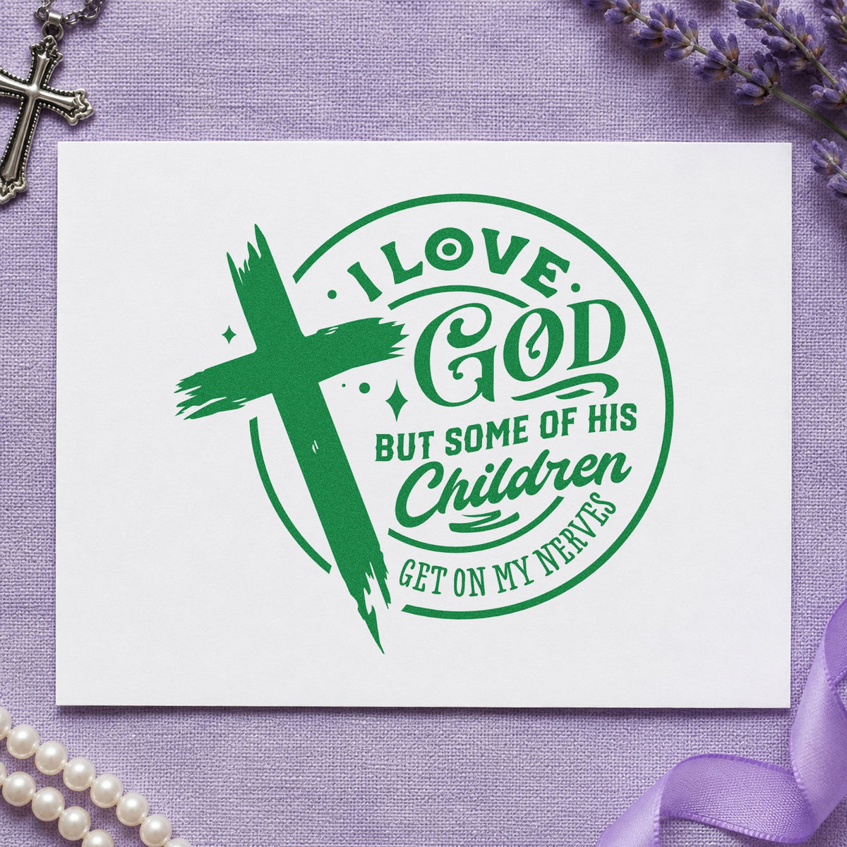 I Love God but His Children craft stamp imprint in green ink on a handmade project, one idea being framed break room art.