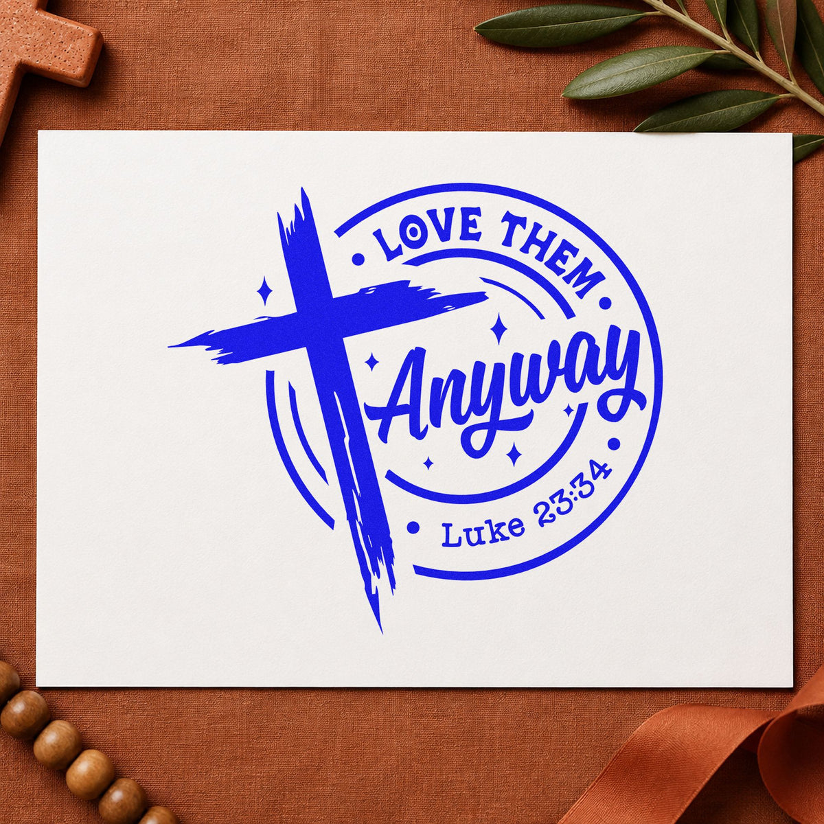Love Them Anyway craft stamp imprinted in blue ink on paper, a design suited to mediation table cards.