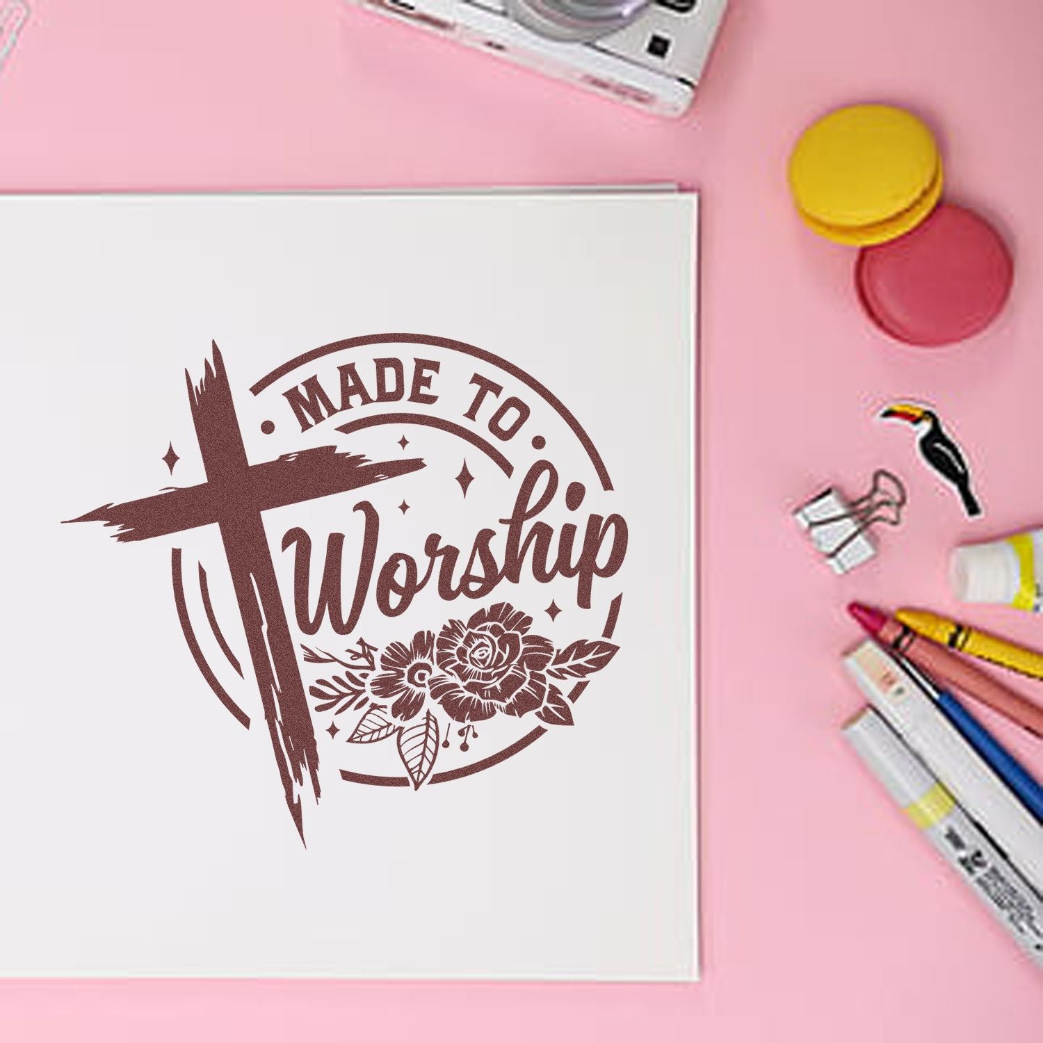 Christian rubber stamp design reading Made to Worship with cross and floral accents on a craft notebook.