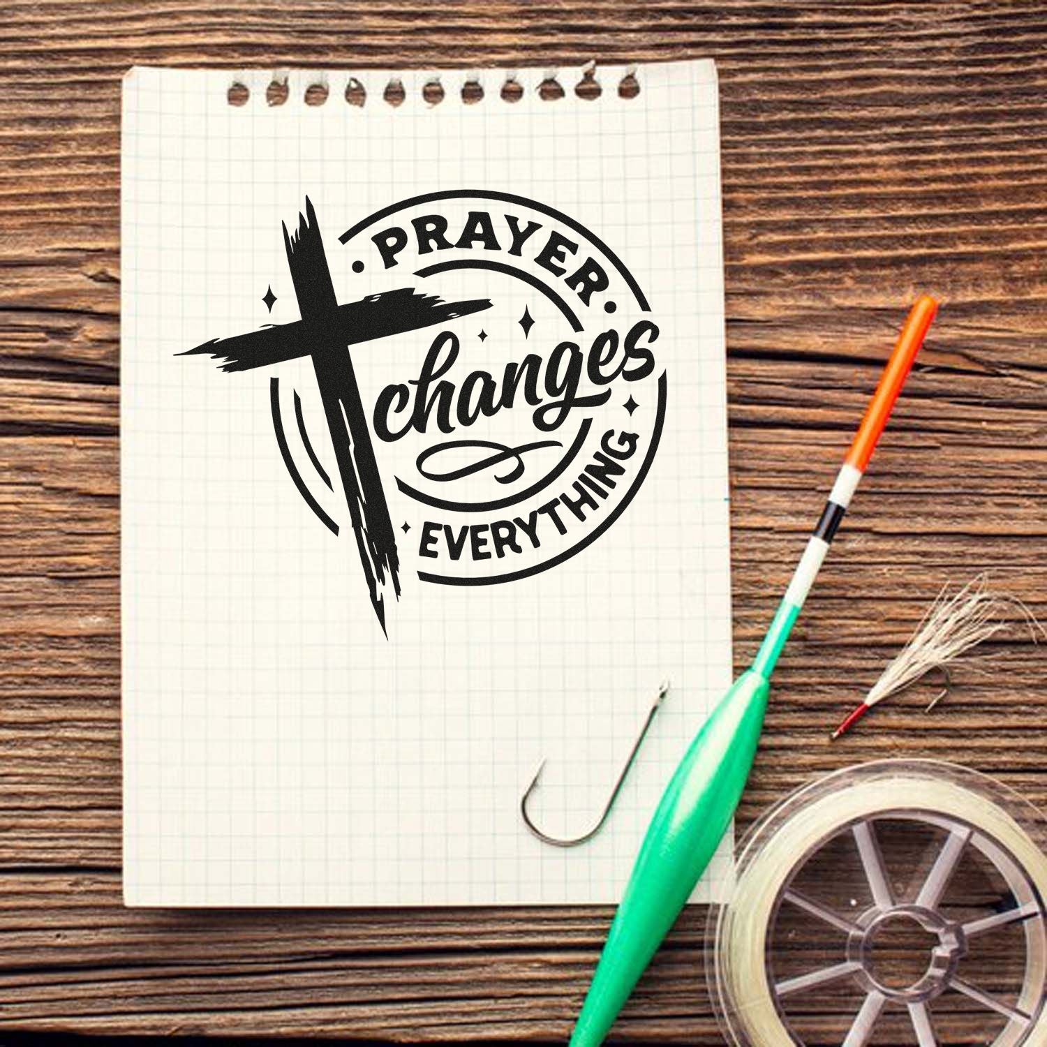 Prayer Changes Everything Christian cross rubber stamp design for faith-based crafts and Bible journaling on notebook paper.