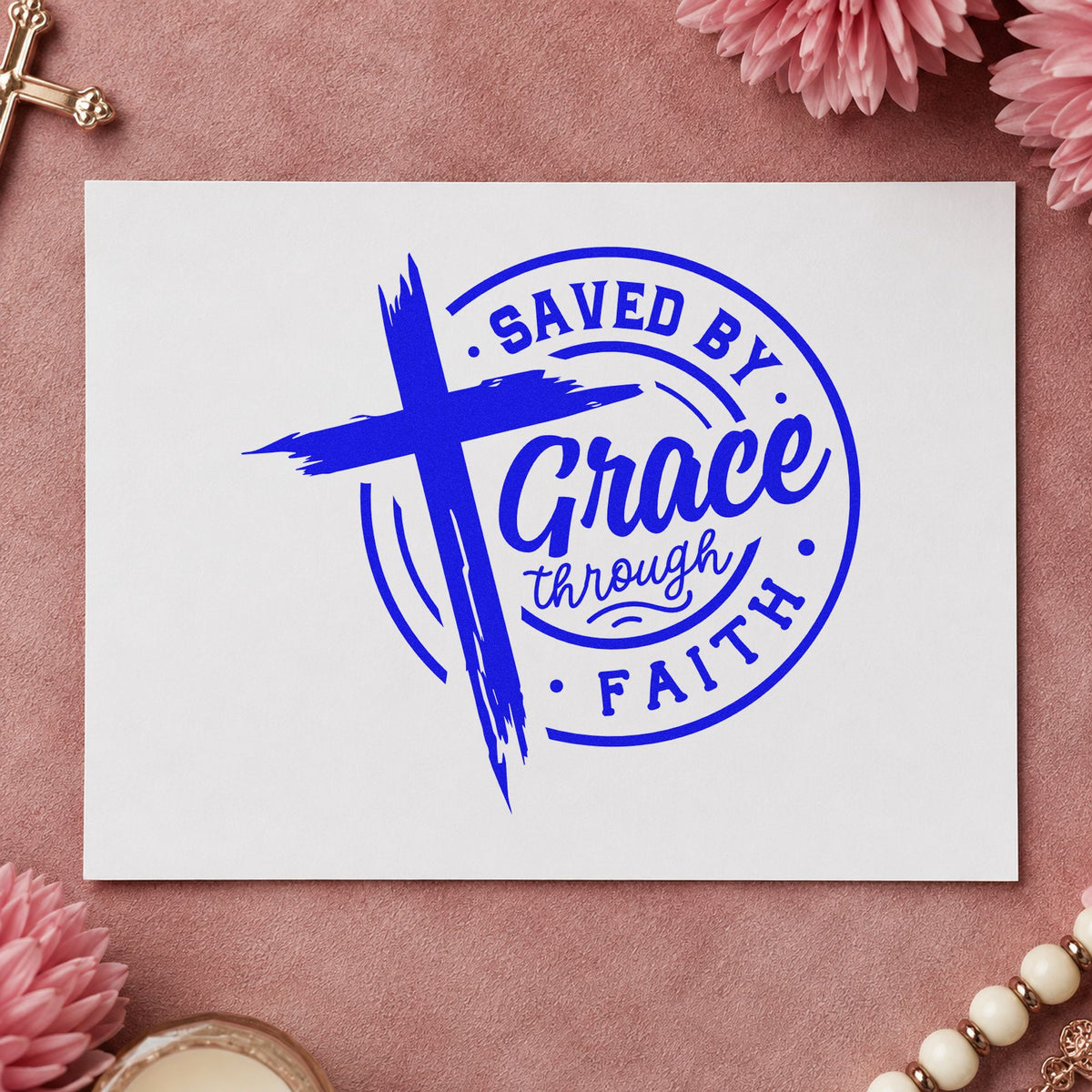 Saved by Grace Through Faith craft stamp imprinted in blue ink on paper, a design suited to communion cup labels.