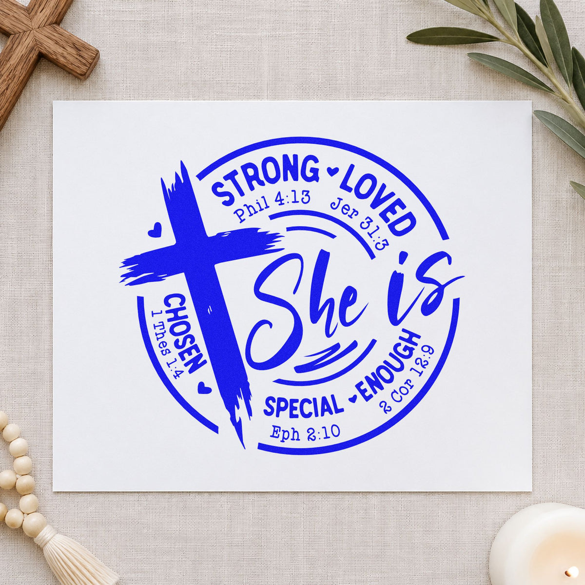 She Is Strong Loved Chosen craft stamp imprinted in blue ink on paper, a design suited to bible tab labels.