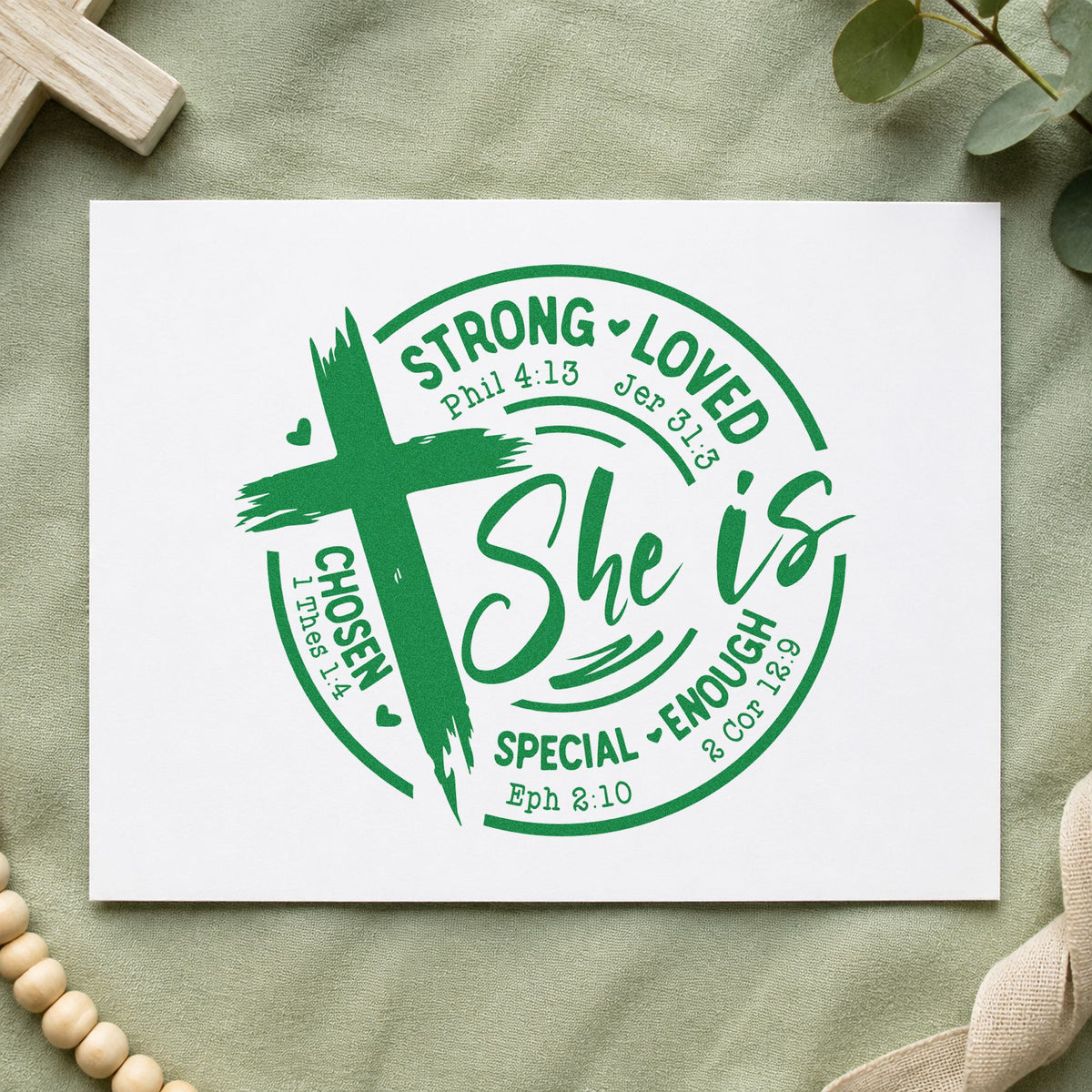 She Is Strong Loved Chosen craft stamp imprint in green ink on a handmade project, one idea being framed closet wall.