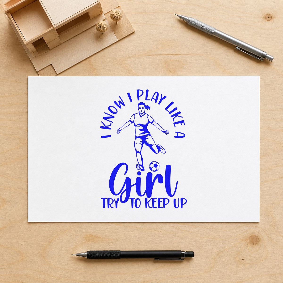 I Play Like a Girl craft stamp imprinted in blue ink on paper, a design suited to girls league banners.