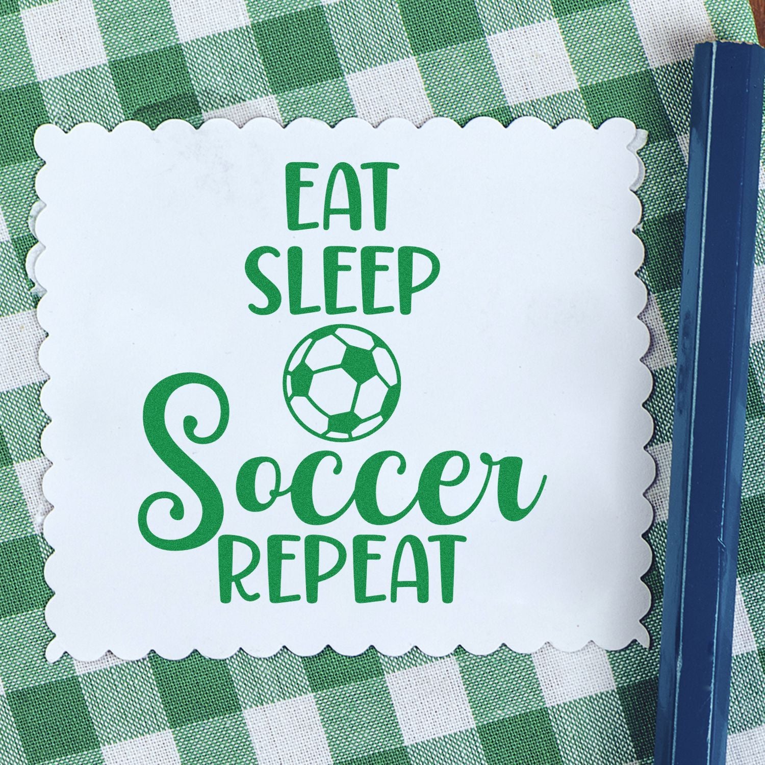Soccer-themed rubber stamp with Eat Sleep Soccer Repeat slogan for sports crafts, scrapbooking, and kids projects.