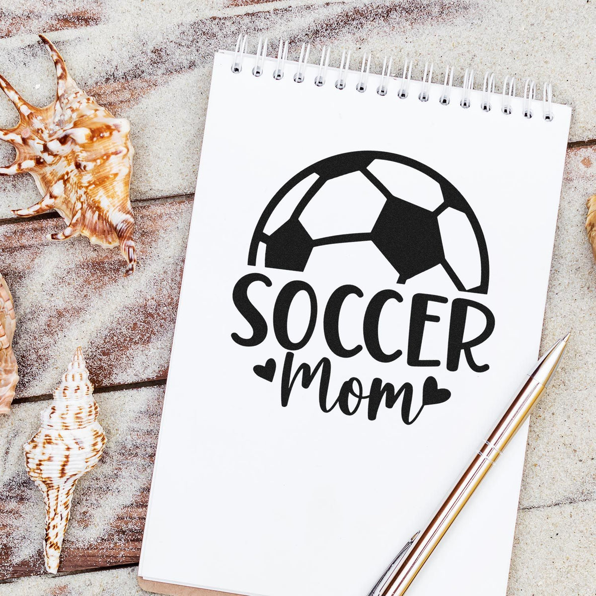 Soccer Mom Ball With Hearts Stamp - Premium Vintage Pro Wooden imprint stamped in black ink. A large partial soccer ball sits above "Soccer mom," with heart accents.