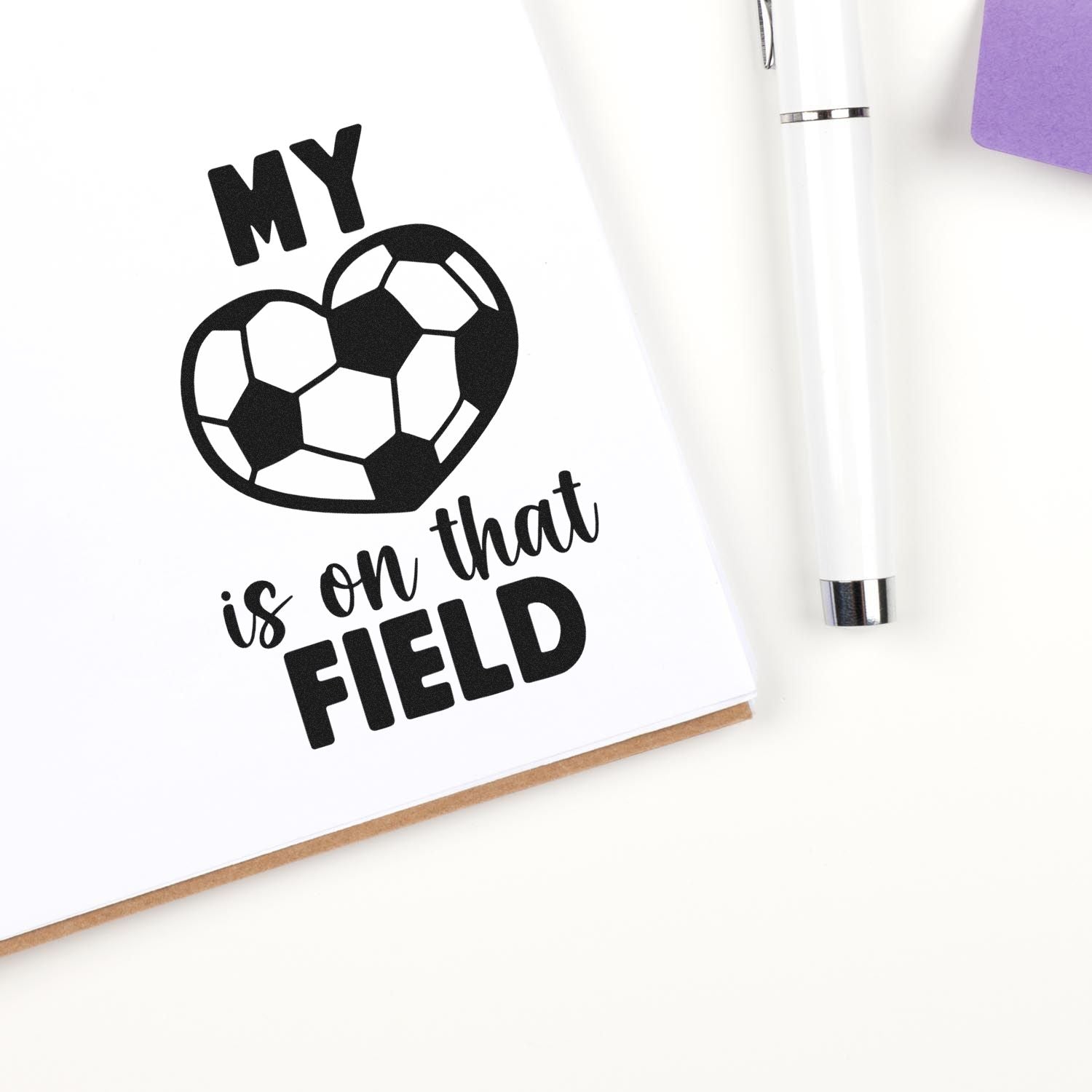 Soccer rubber stamp design with heart-shaped ball and My heart is on that field phrase for coaches and players.