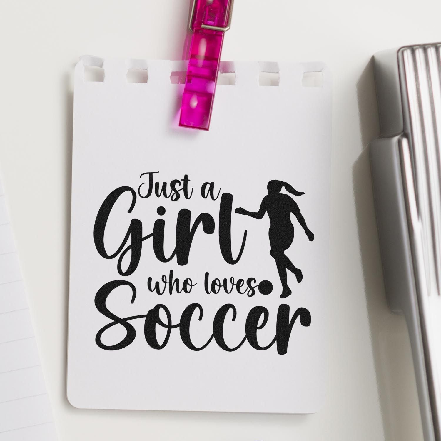Custom rubber stamp design reading Just a Girl Who Loves Soccer with female player silhouette for sports-themed crafting.