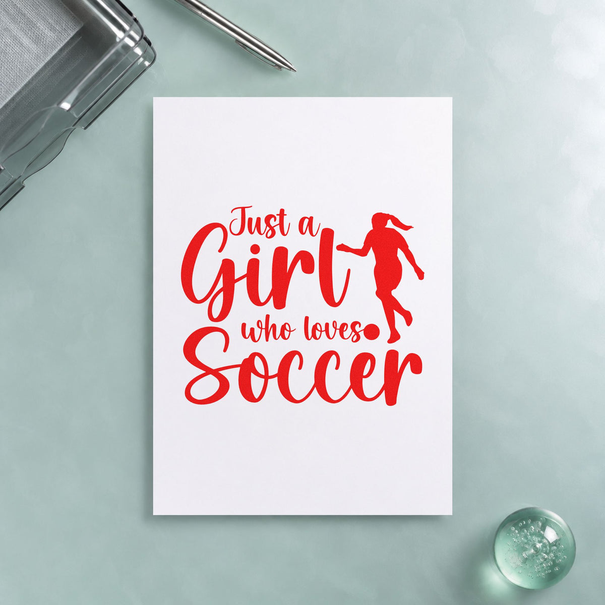 Girl Who Loves Soccer Silhouette rubber stamp shown in red ink, stamped for projects such as away trip notes.