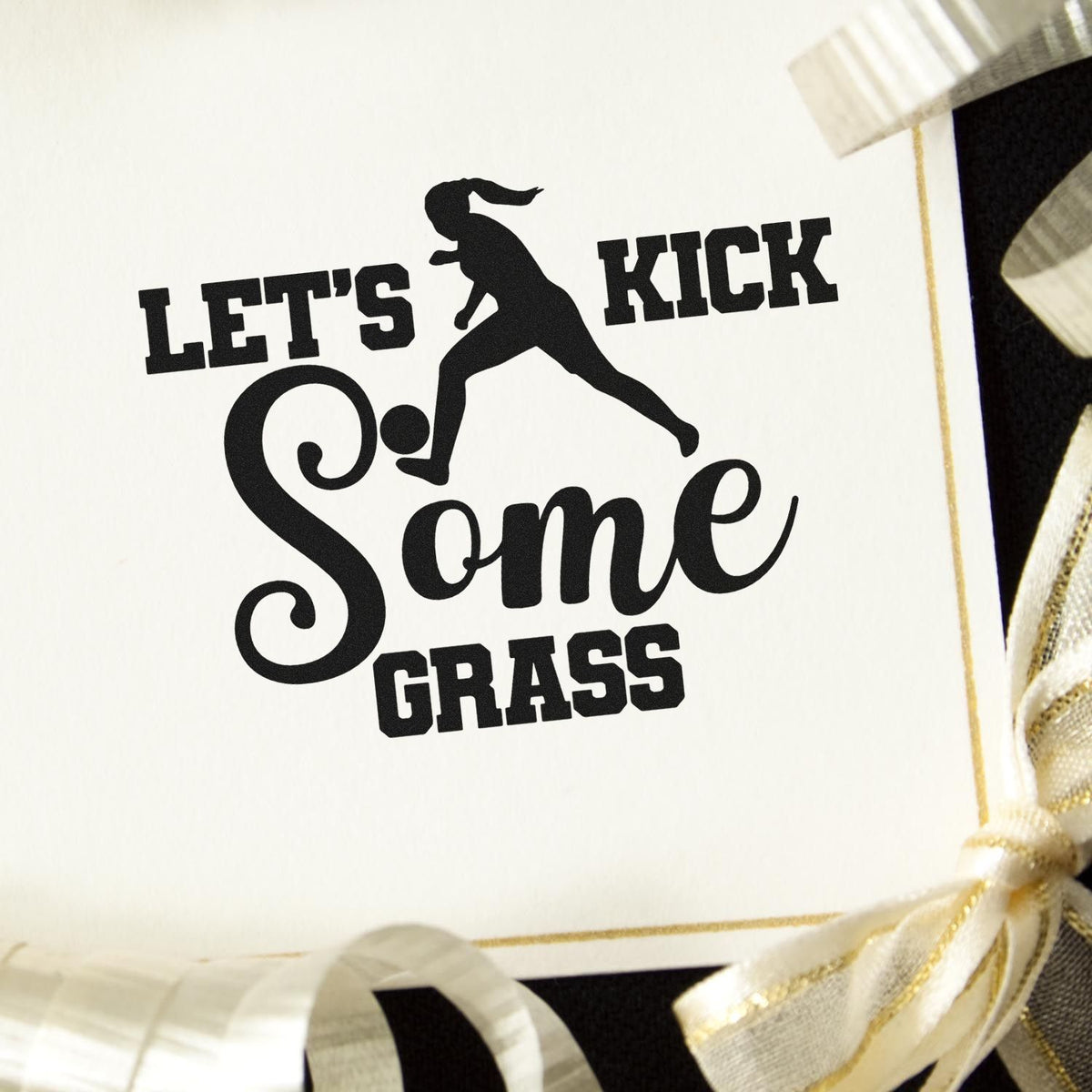 Let's Kick Some Grass Script Lettering Premium Wooden Stamp - Vintage Pro imprint stamped in black ink. A kicking player silhouette appears within "Let's kick some grass" in bold and script lettering.