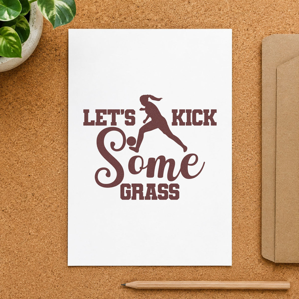 Let's Kick Some Grass rubber stamp printed in brown ink, ready for grass seed labels and similar paper crafts.