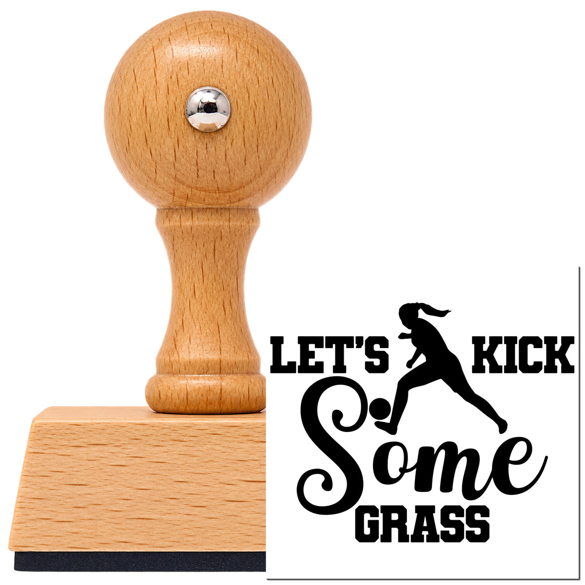 Let's Kick Some Grass Script Lettering Vintage Pro rubber stamp in European beech wood with a round knob handle, shown beside its black imprint.