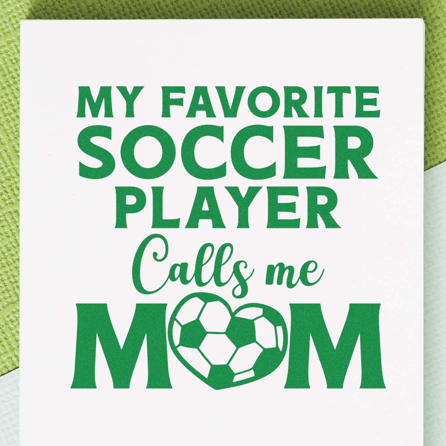 Soccer mom rubber stamp design reading My favorite soccer player calls me mom with soccer ball graphic.
