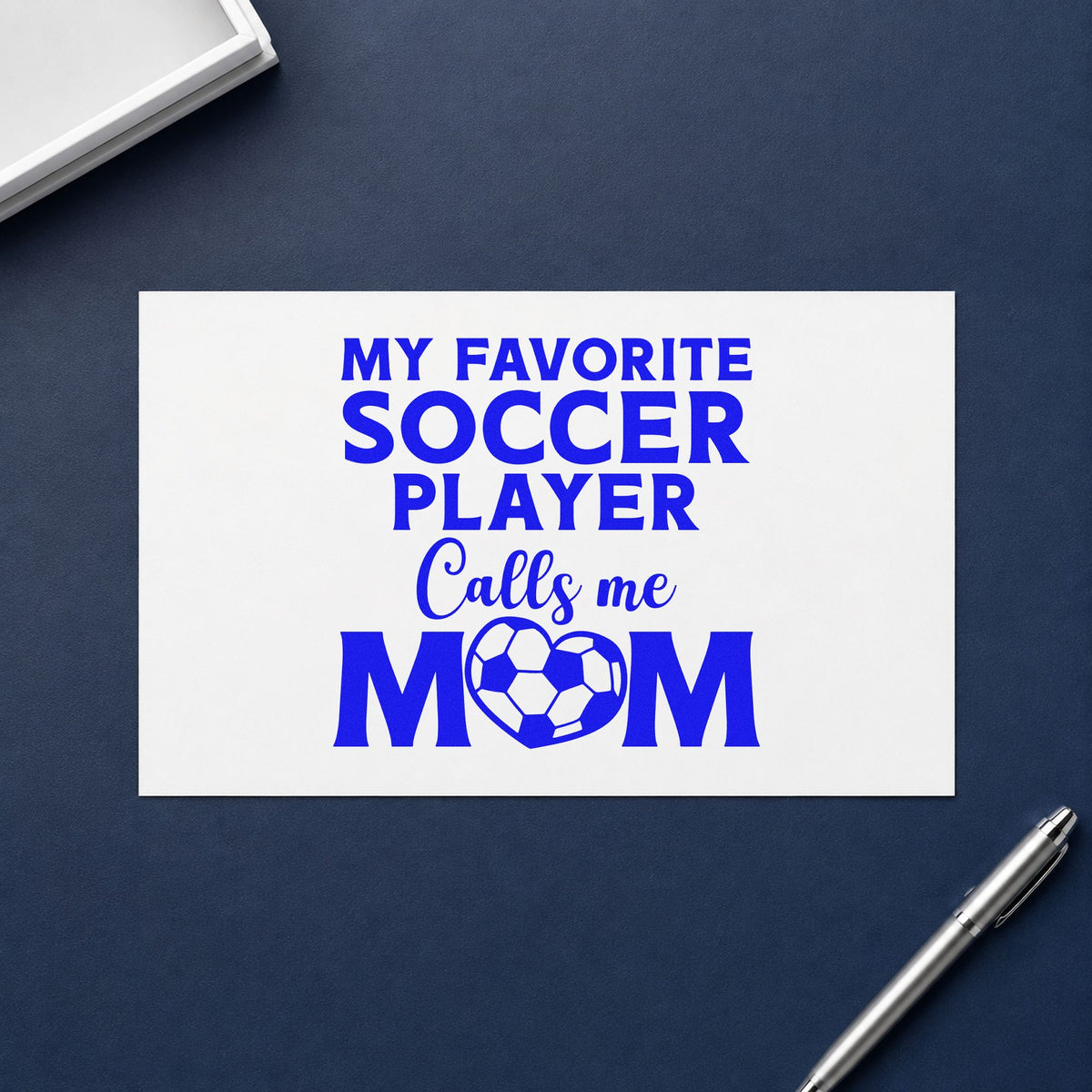 Favorite Soccer Player Calls Me Mom craft stamp in blue ink on cardstock, an easy option for visor brim transfers.