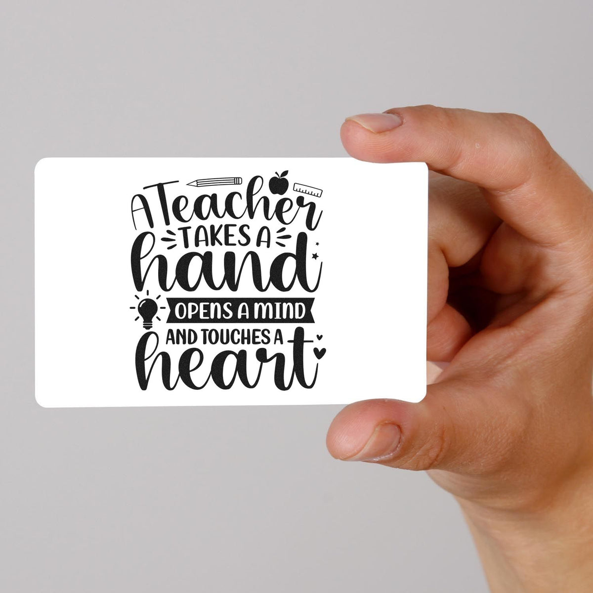 Teacher Touches A Heart School Tools Stamp - Premium Vintage Pro Wooden imprint stamped in black ink. A pencil, ruler, apple, and lightbulb accent "A teacher takes a hand, opens a mind, and touches a heart."