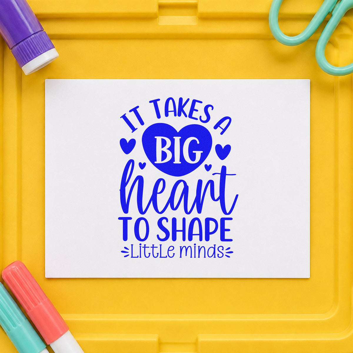 Big Heart Shapes Little Minds craft stamp imprinted in blue ink on paper, a design suited to daycare sign bands.