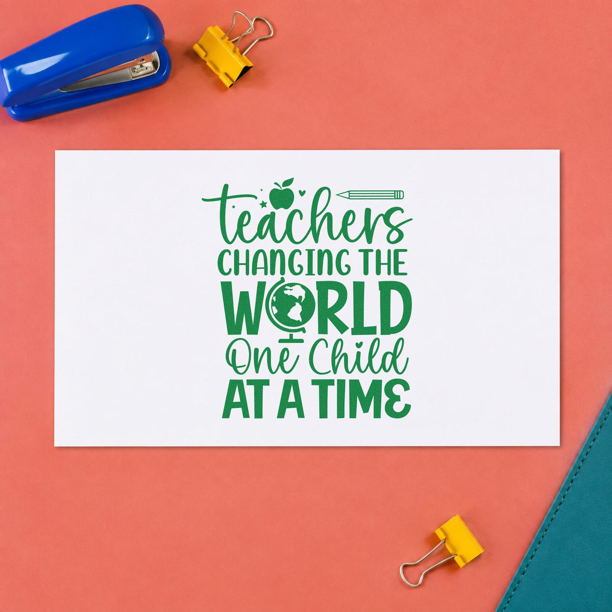 Teachers Changing the World craft stamp imprint in green ink on a handmade project, one idea being passport craft pages.
