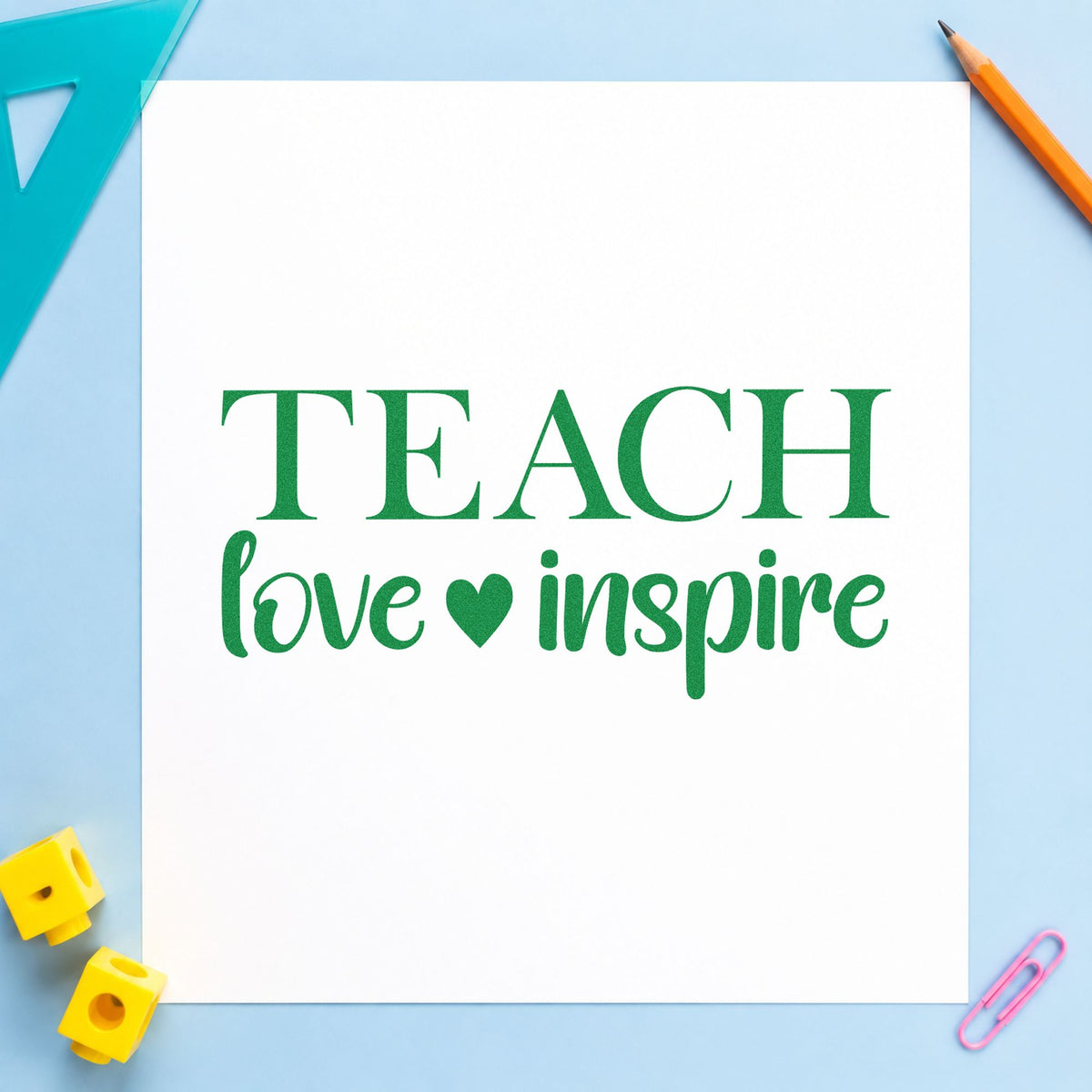 Teach Love Inspire Serif craft stamp imprint in green ink on a handmade project, one idea being diploma folder pages.