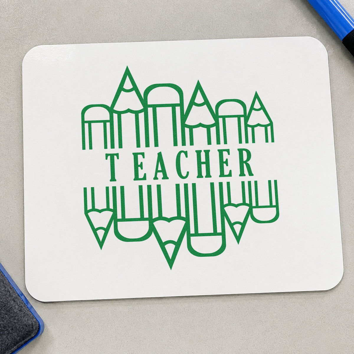 Teacher Pencil Circle craft stamp imprint in green ink on a handmade project, one idea being writing journal pages.
