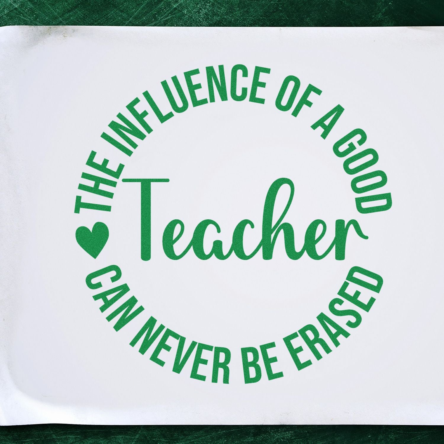 Custom rubber stamp design reading The influence of a good teacher can never be erased with heart in green script.